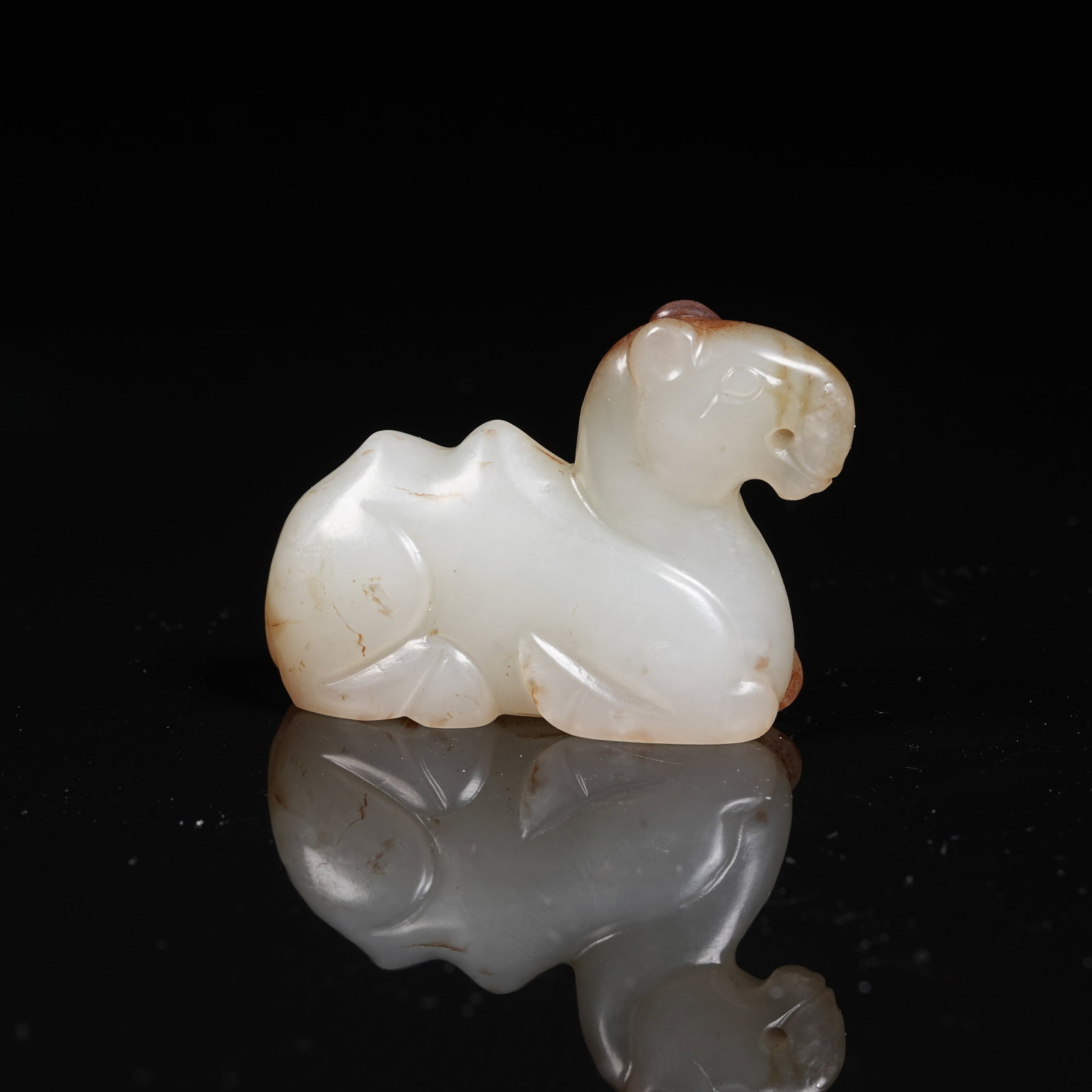 A ARCHAIC JADE CAMEL PENDANT (1 of 8)