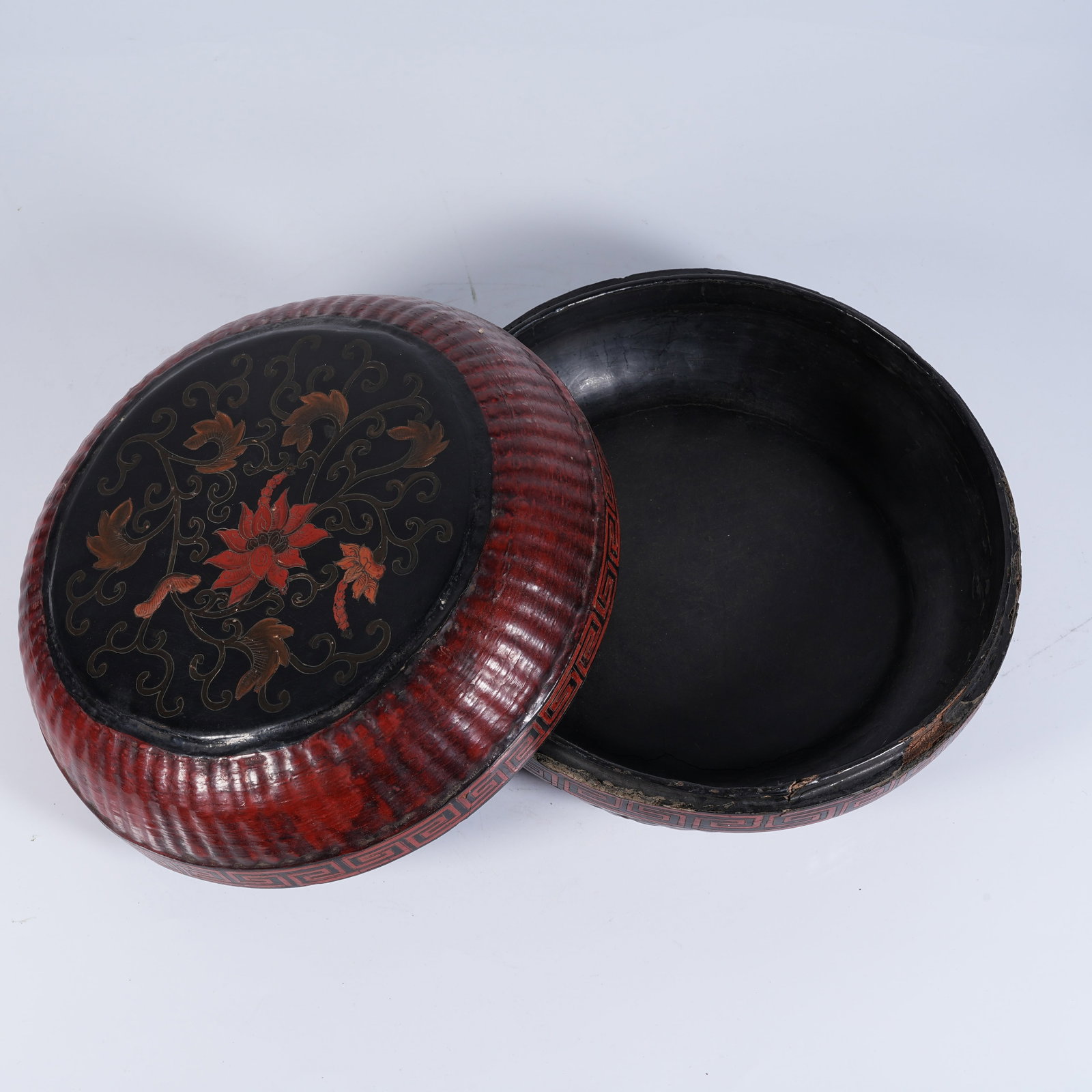 A CARVED RED LACQUER HOLDING BOX WITH FLORAL PATTERN (1 of 10)