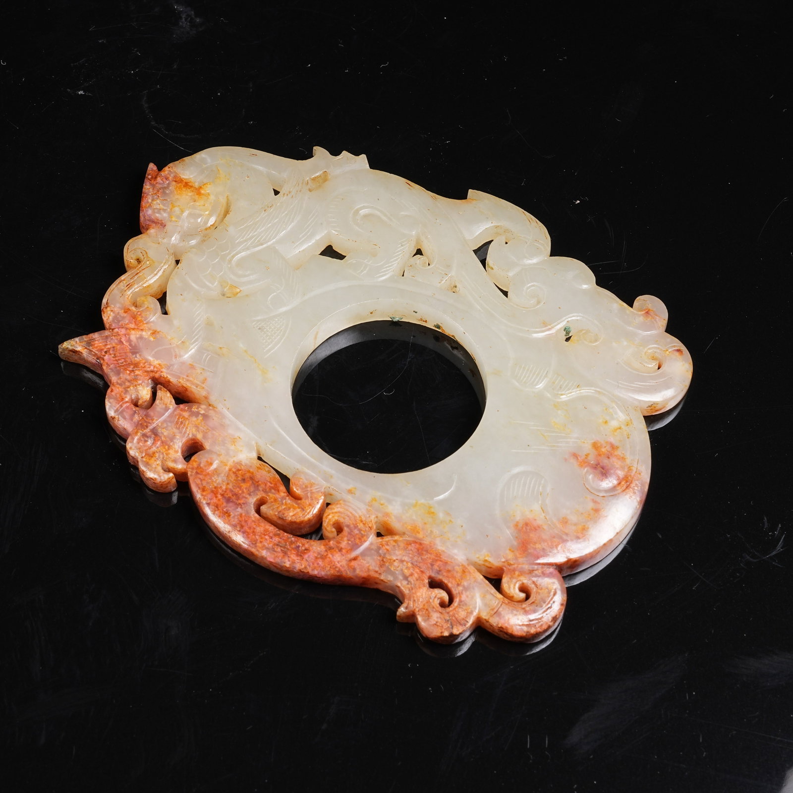 A ARCHAIC JADE HEART-SHAPED PENDANT WITH CHI DRAGON PATTERN (1 of 10)