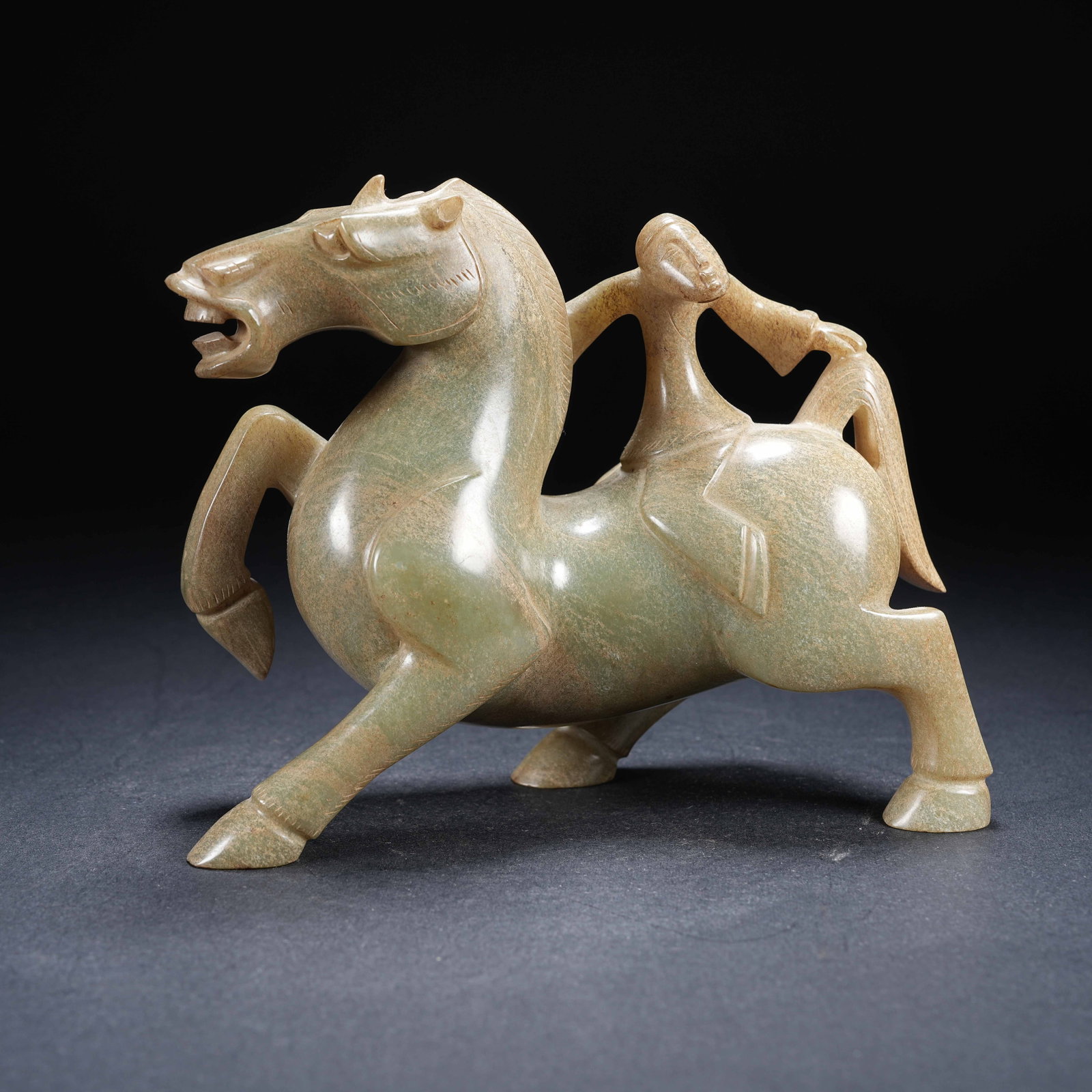 A ARCHAIC JADE FIGURINE OF HUMAN RIDING BEAST (1 of 8)