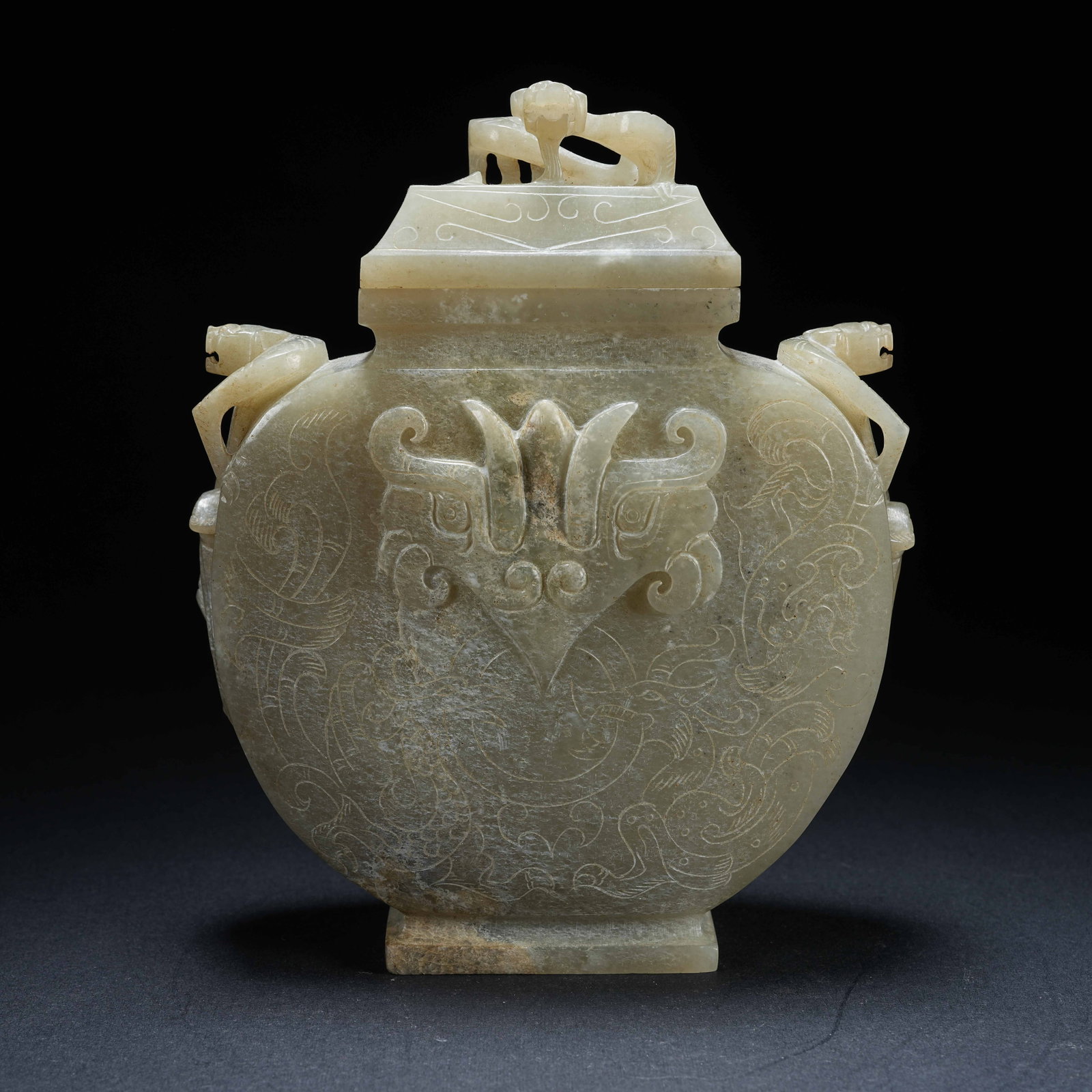 A ANCIENT JADE LIDDED VASE WITH BEAST MASK AND TRIPLE DRAGON PATTERN (1 of 10)