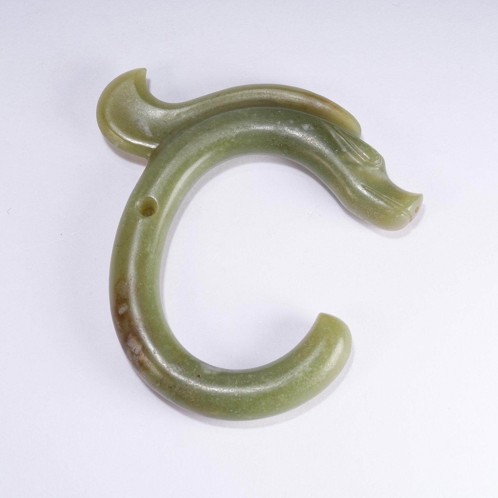 A ANCIENT JADE C-SHAPED DRAGON PENDANT: Ancient Jade C-shaped Dragon Pendant