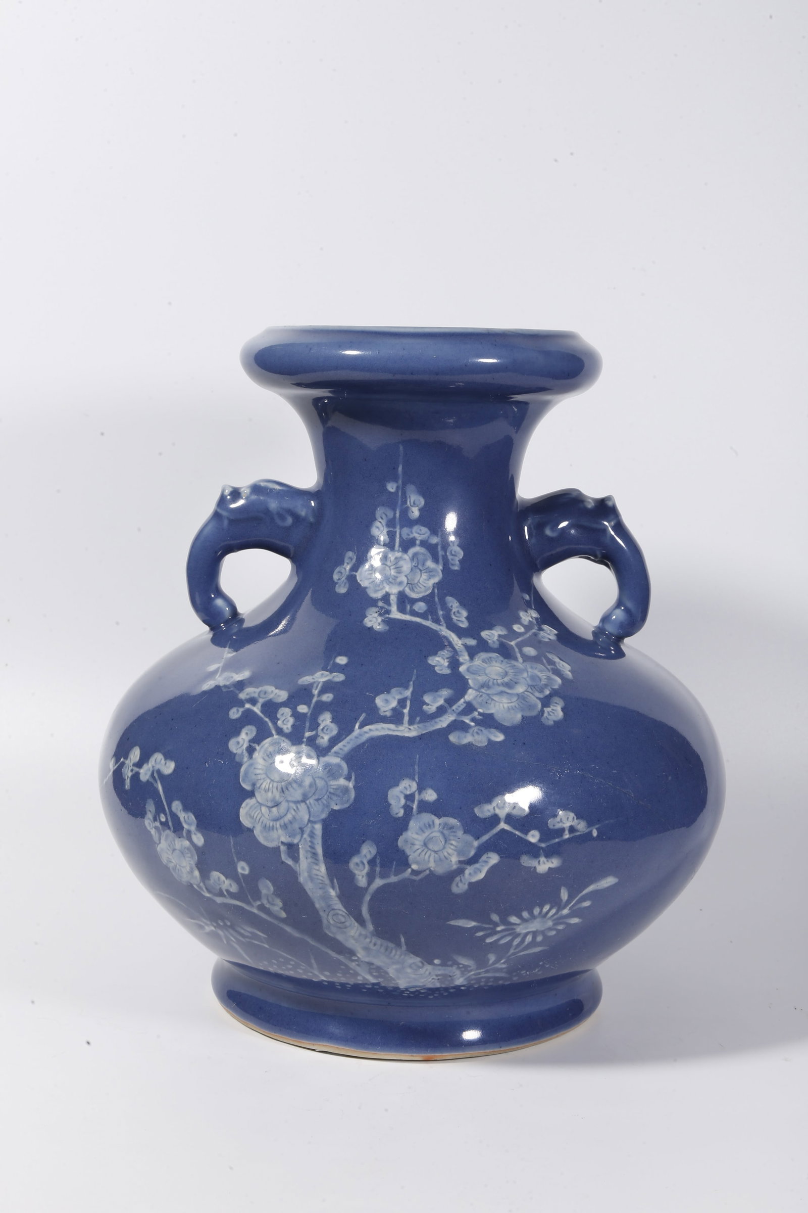 A BLUE GLAZE WHITE-RELIEF PLUM BLOSSOM PATTERN DOUBLE-EARED VASE (1 of 9)