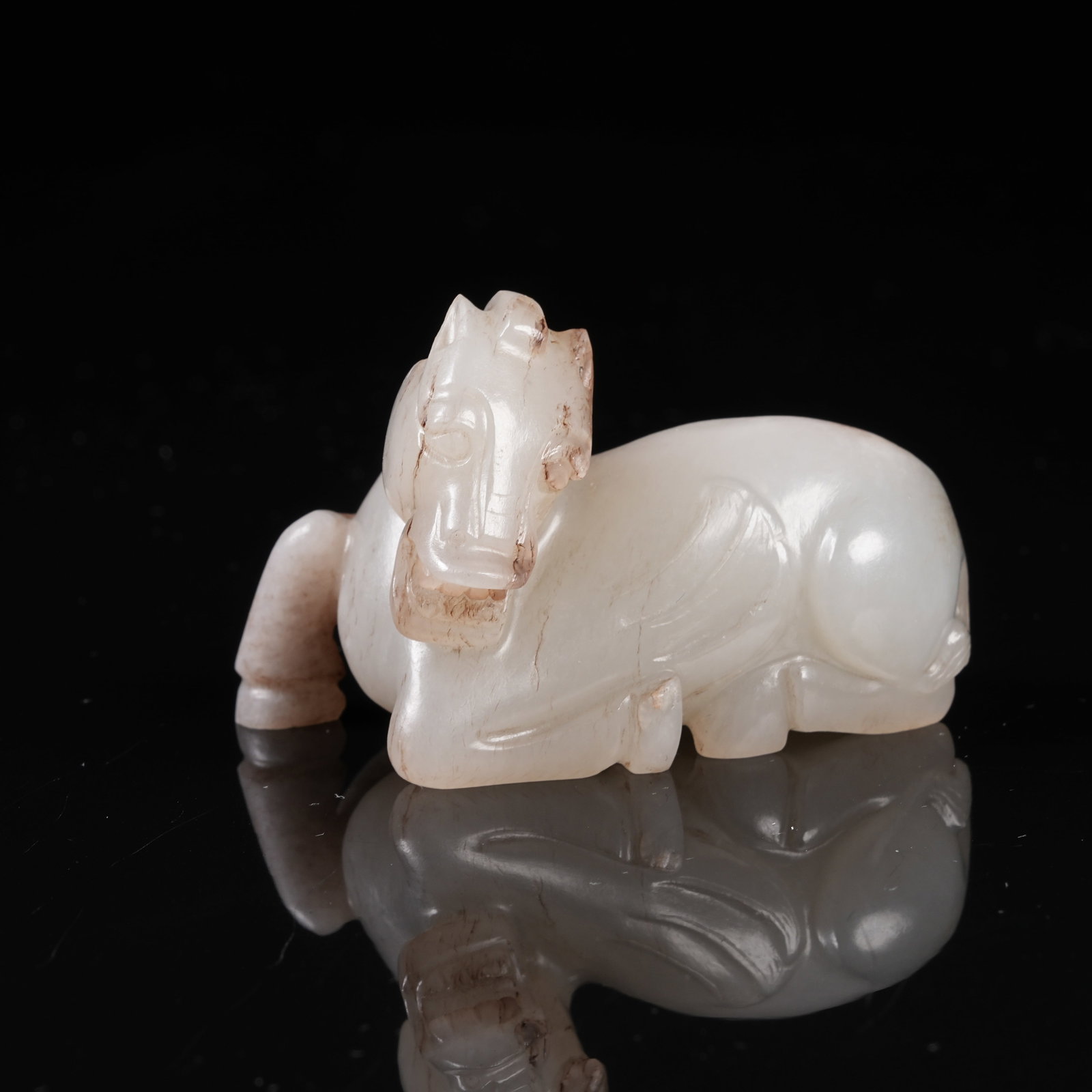 A ARCHAIC JADE RECUMBENT HORSE ORNAMENT: Archaic Jade Recumbent Horse Ornament