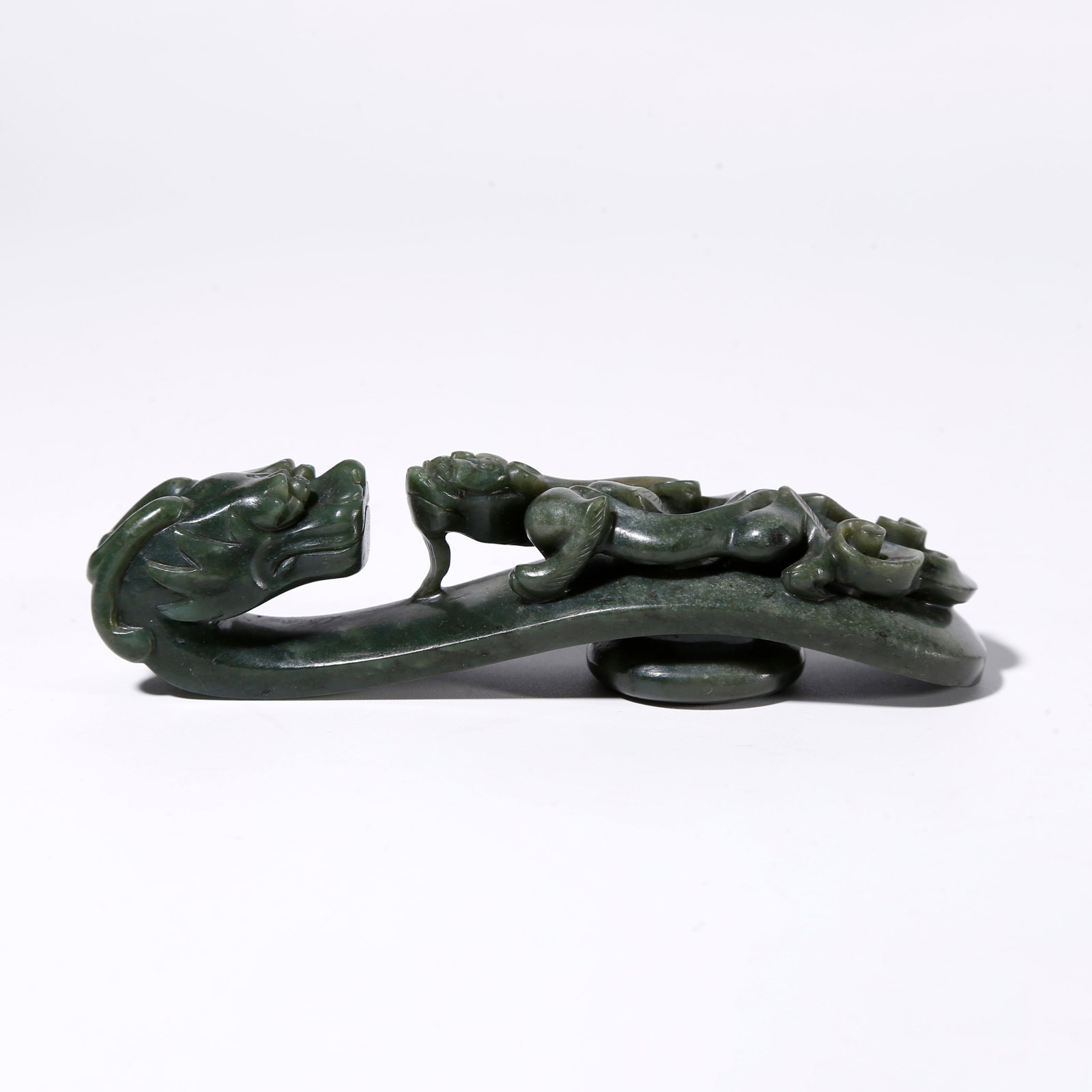 A DRAGON-SHAPED HETIAN JADE BELT HOOK: Dragon-shaped Hetian Jade Belt Hook