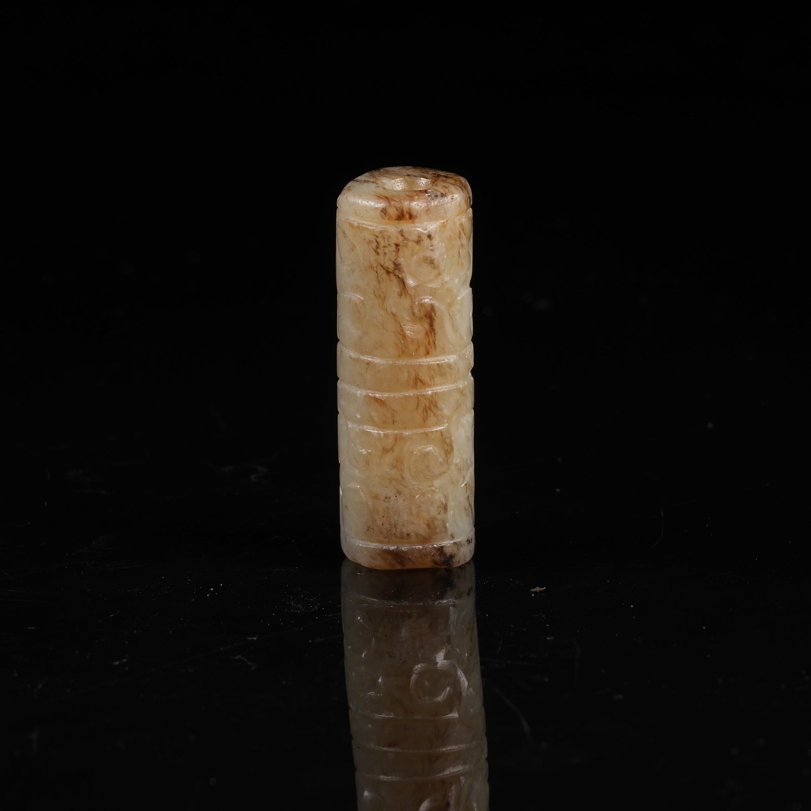 A ARCHAIC JADE TUBE BEAD WITH INTERLOCKING CLOUD MOTIF: Archaic Jade Tube Bead with Interlocking Cloud Motif