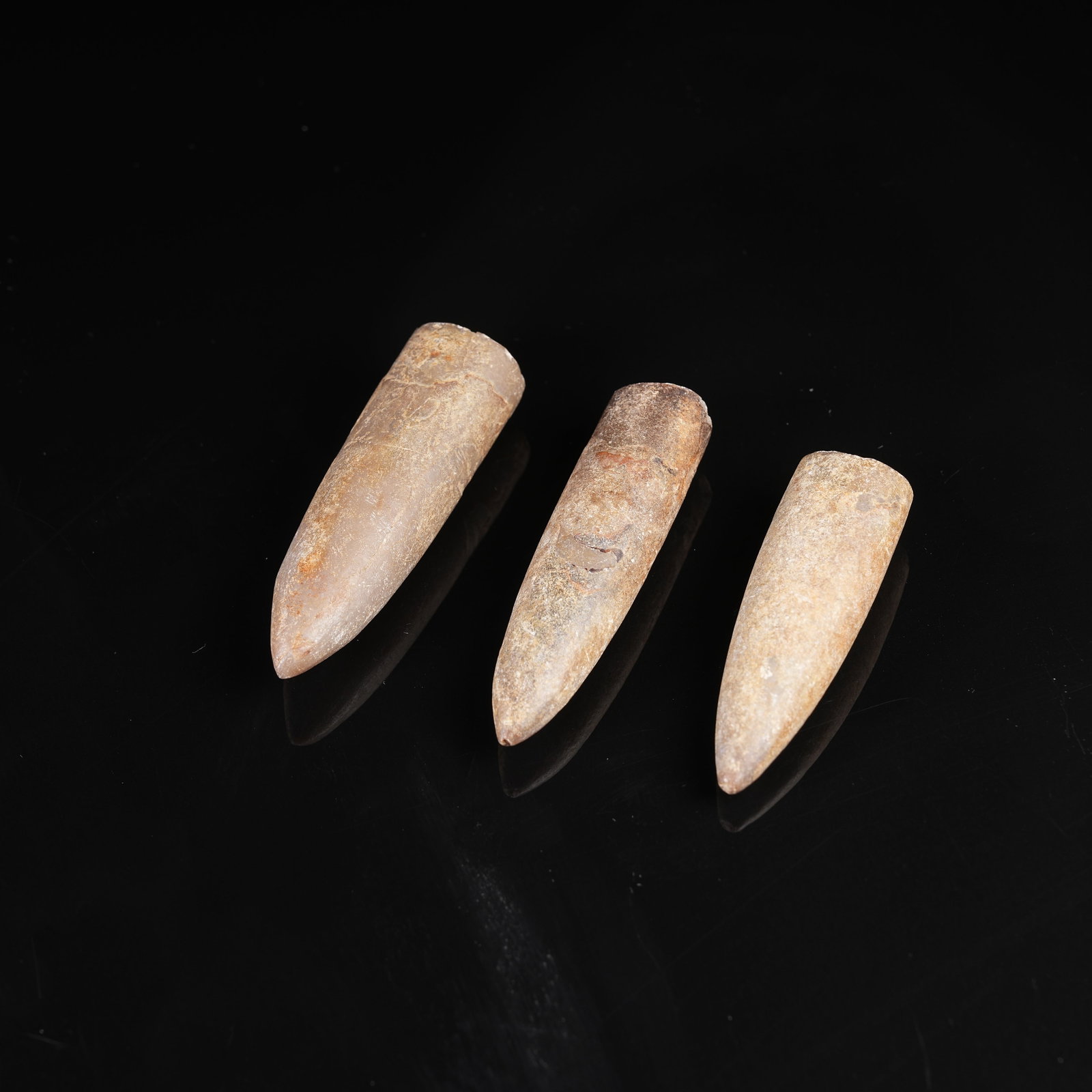 A SET OF ARCHAIC JADE STUDS: Set of Archaic Jade Studs