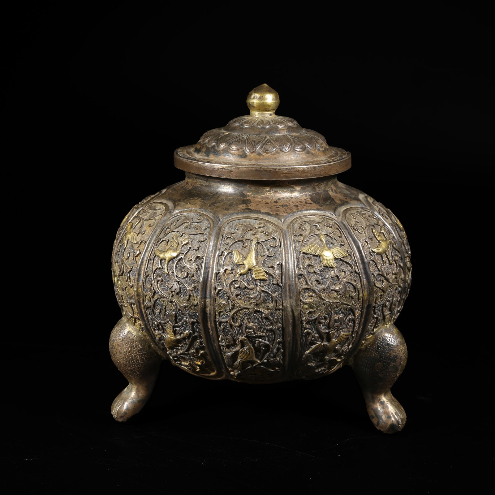 A SILVER PARTIALLY GILT COVERED JAR WITH BIRD AND FLOWER DESIGN: Silver Partially Gilt Covered Jar with Bird and Flower Design