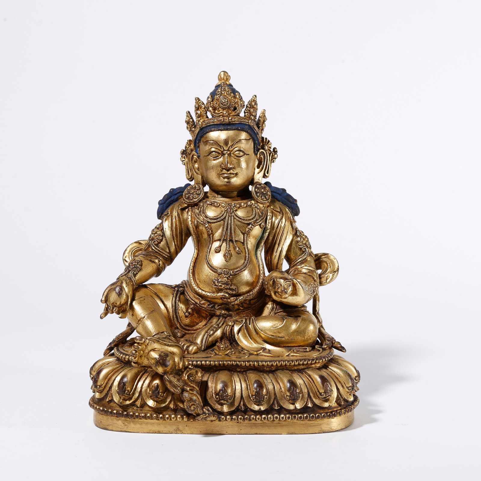 A GILT BRONZE STATUE OF YELLOW JAMBHALA: Gilt Bronze Statue of Yellow Jambhala