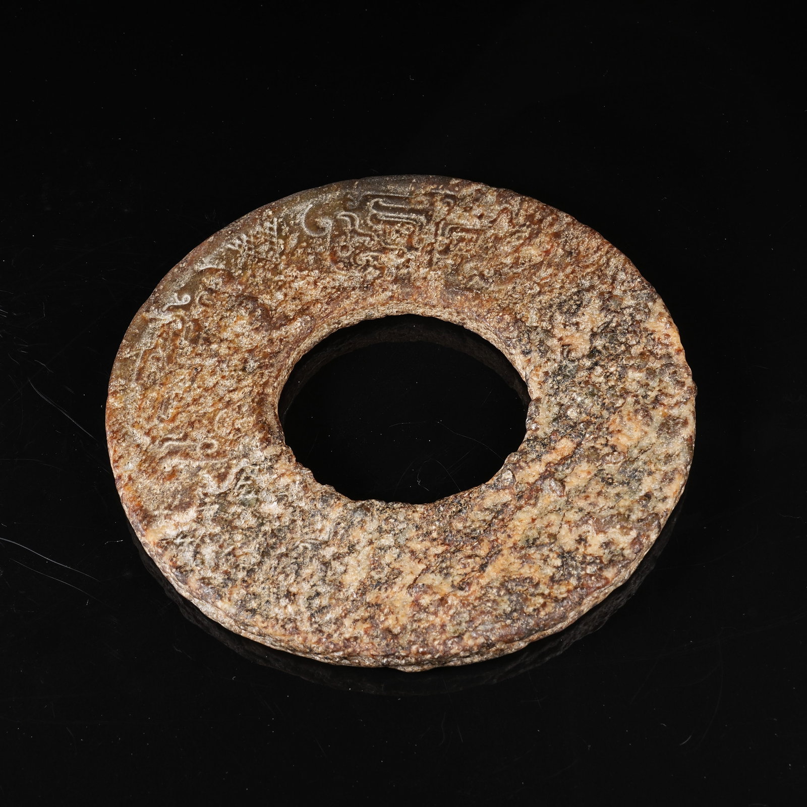 A ARCHAIC JADE BI DISC WITH BEAST MASK MOTIF: Archaic Jade Bi Disc with Beast Mask Motif