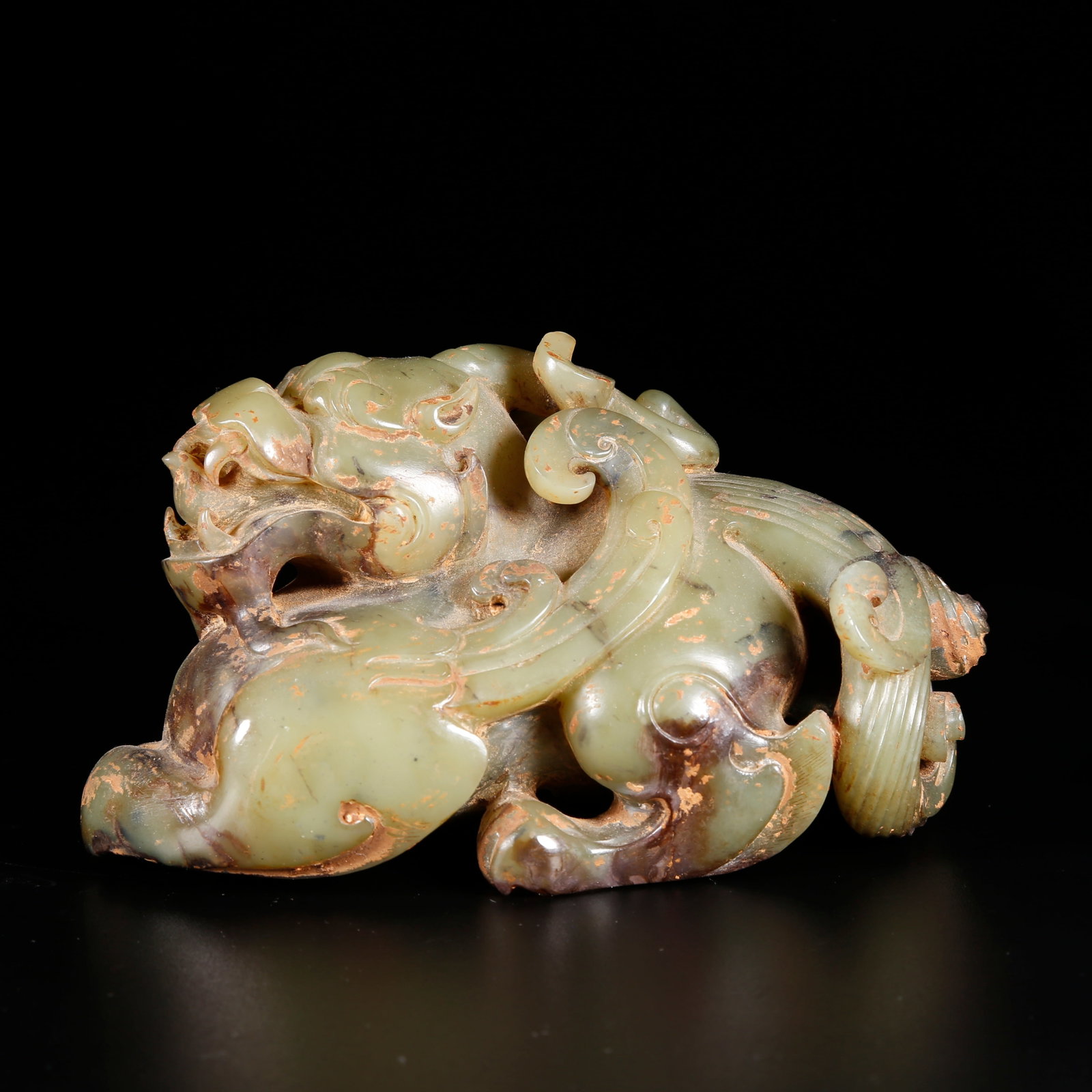 A HETIAN JASPER LION ORNAMENT: Hetian Jasper Lion Ornament