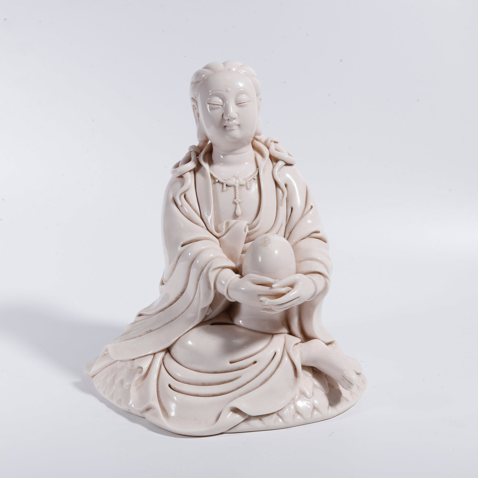 A DEHUA WHITE PORCELAIN FREE GUANYIN STATUE (1 of 9)