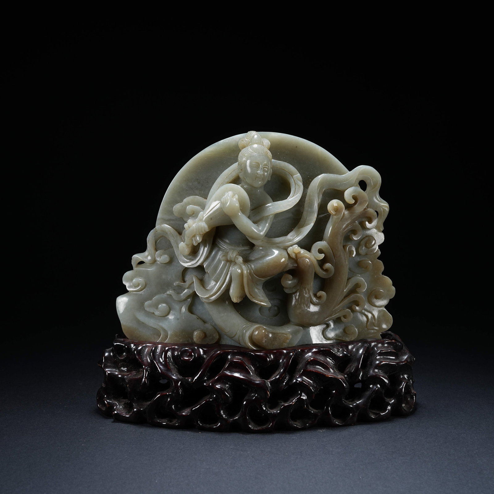 A HETIAN JADE ORNAMENT OF PLAYING XIAO TO ATTRACT PHOENIX: Hetian Jade Ornament of Playing Xiao to Attract Phoenix