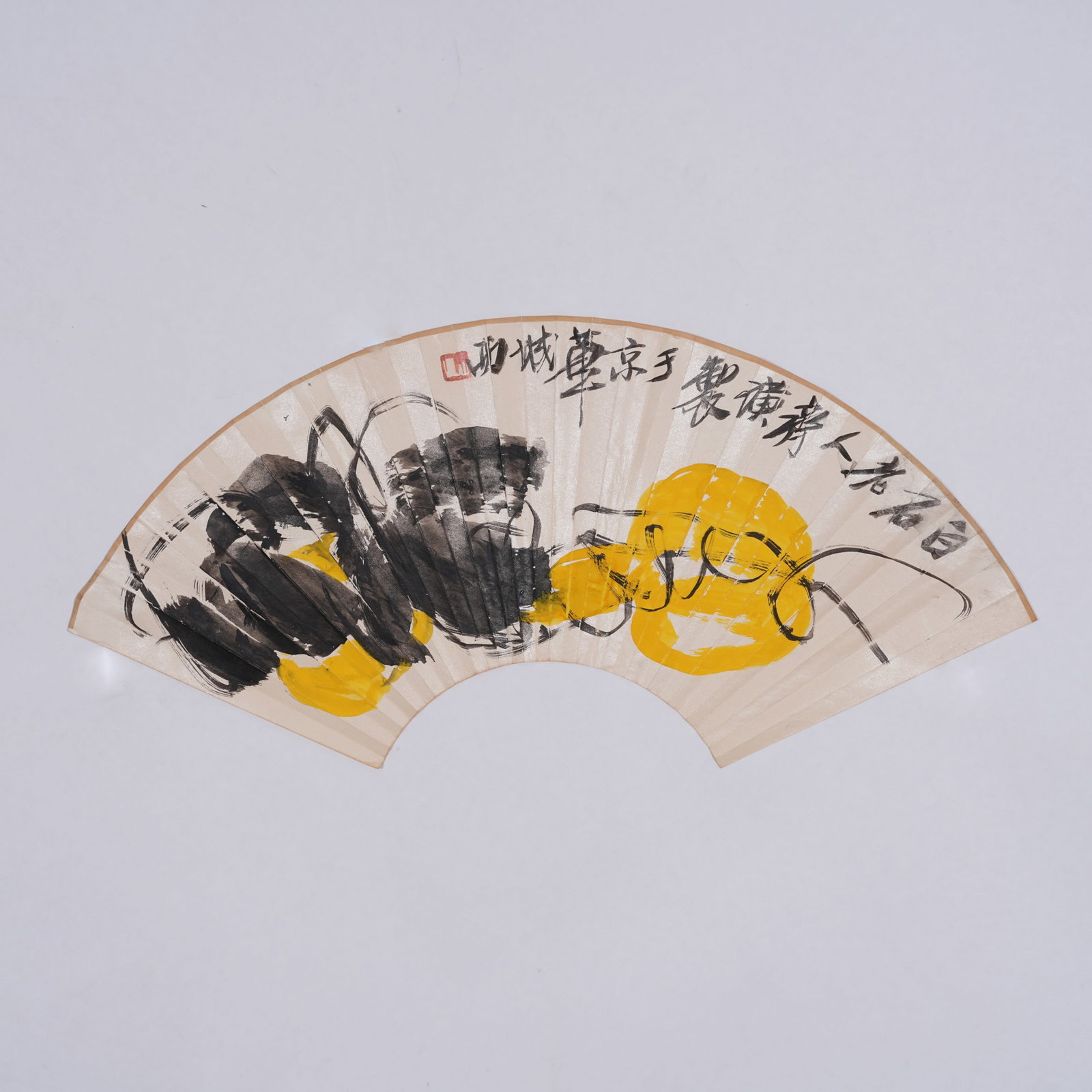 A FAN PAINTING OF FRUITS AND MELONS ON PAPER BY QI BAISHI.齊白石: Fan Painting of Fruits and Melons on Paper by Qi Baishi.齊白石