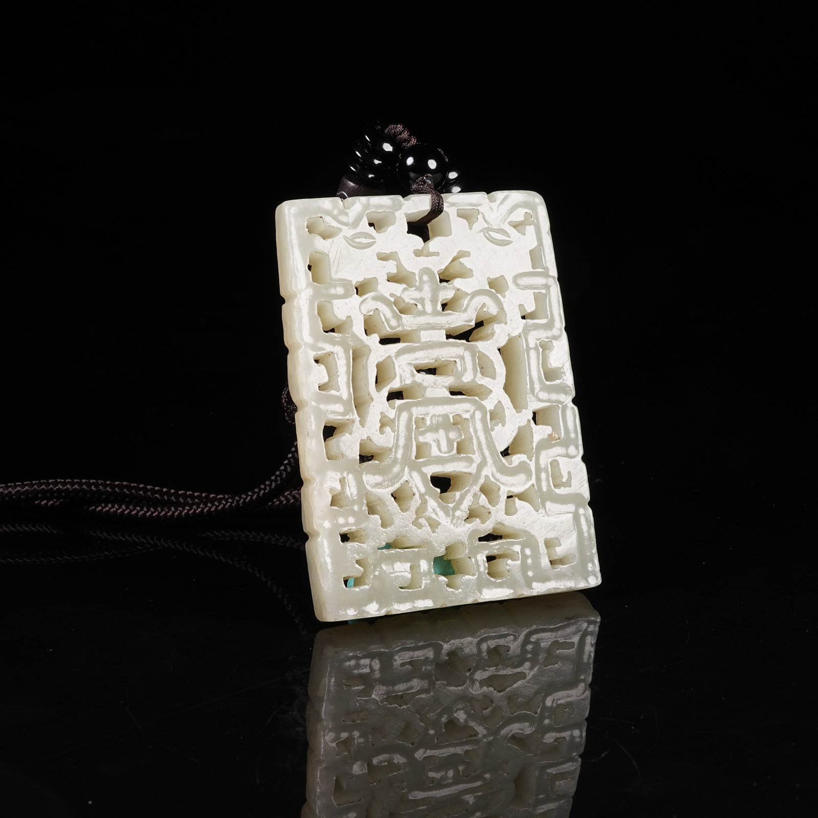 A NEPHRITE PLAQUE WITH LONGEVITY PATTERN: Nephrite Plaque with Longevity Pattern