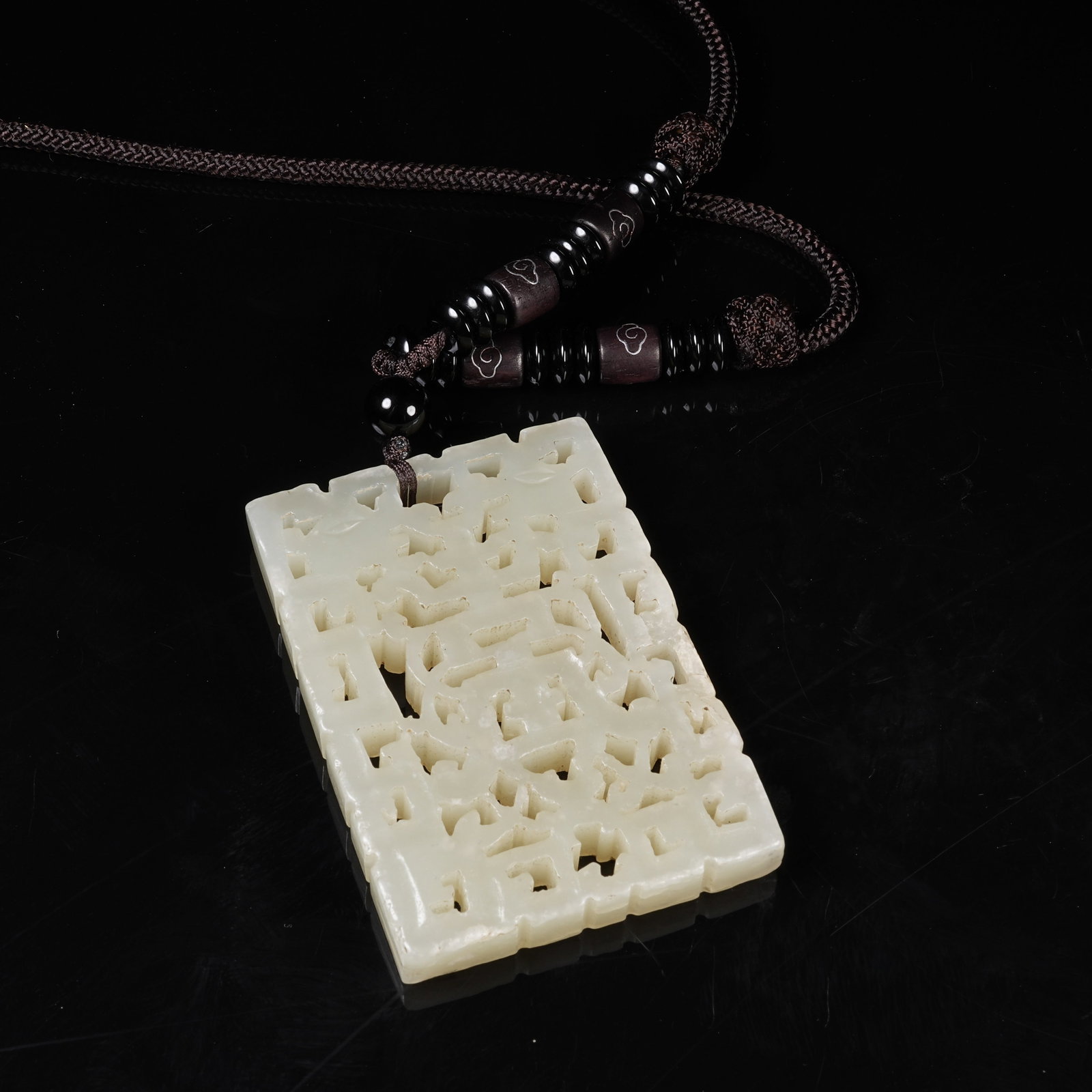 A NEPHRITE PLAQUE WITH LONGEVITY PATTERN - 8