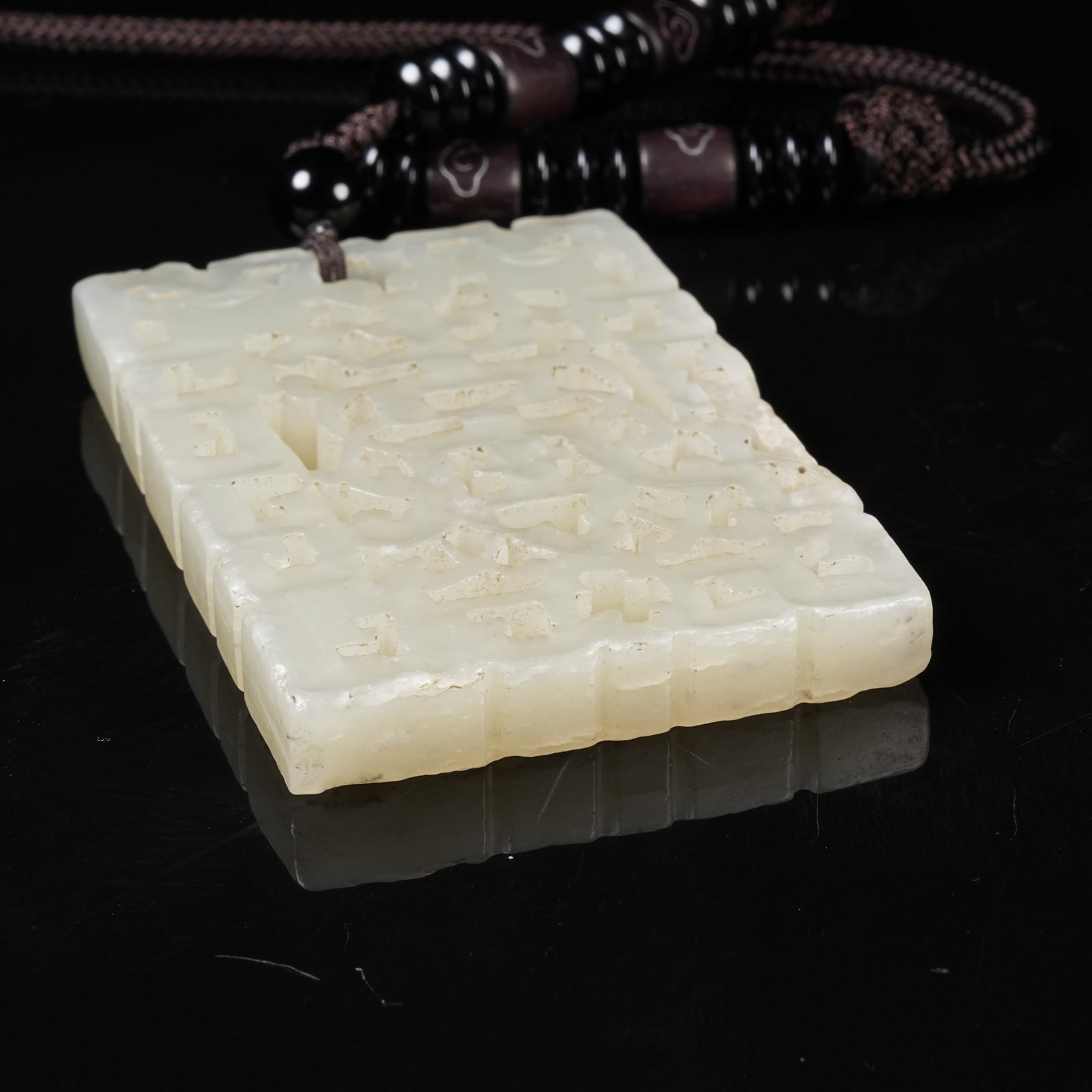 A NEPHRITE PLAQUE WITH LONGEVITY PATTERN - 9