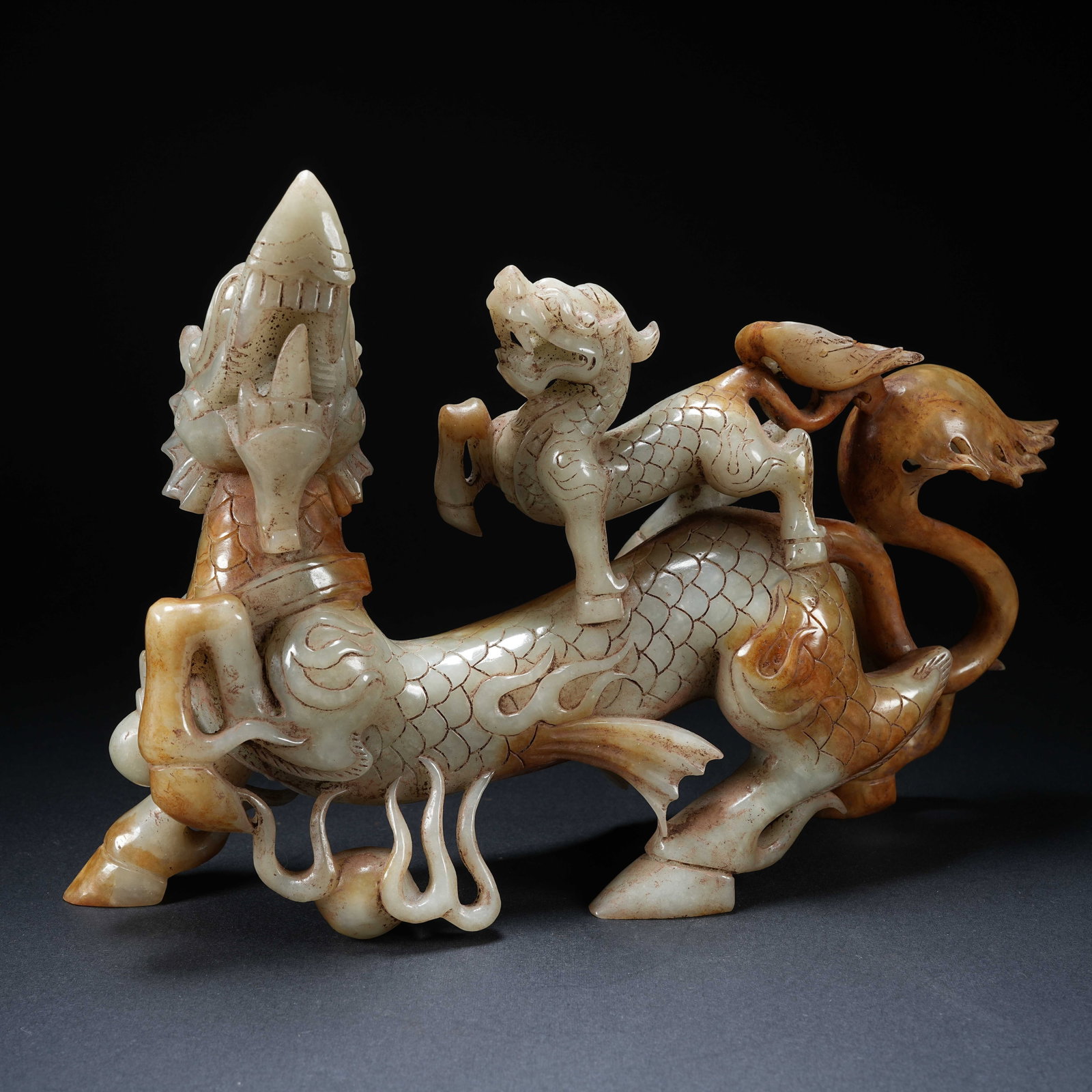 A ANCIENT JADE MOTHER AND CHILD QILIN ORNAMENT: Ancient Jade Mother and Child Qilin Ornament