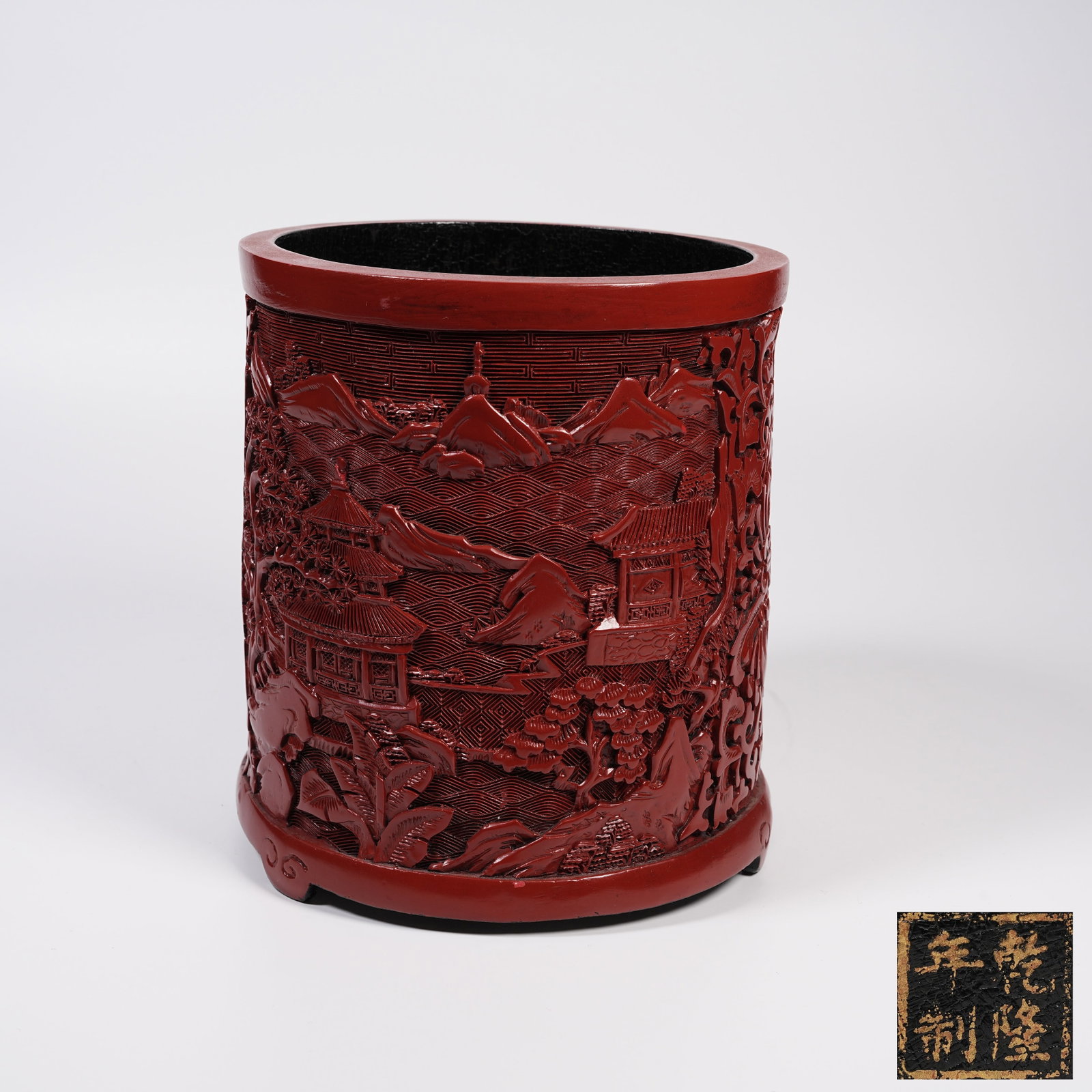 A CARVED RED LACQUER BRUSH POT WITH LANDSCAPE AND PAVILION PATTERN (1 of 9)