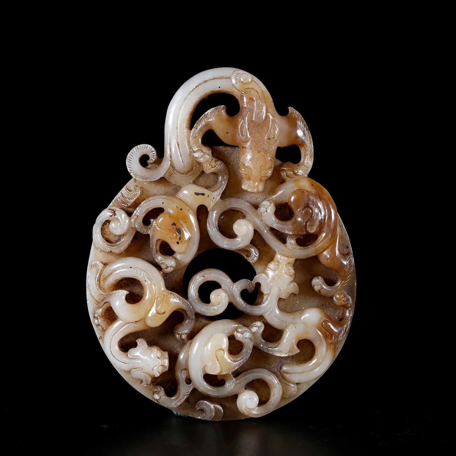 A HETIAN JADE BI DISC CARVED WITH DRAGON PATTERNS (1 of 9)