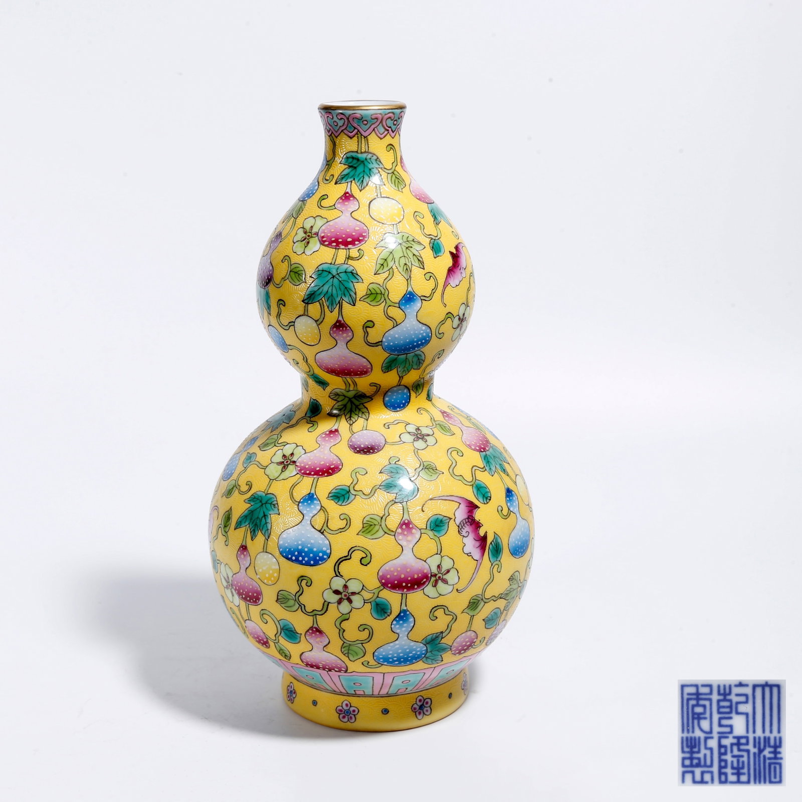 A YELLOW-GROUND FAMILLE ROSE GOURD VASE (1 of 9)