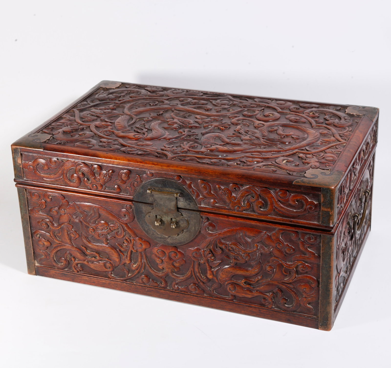 A CARVED HUANGHUALI WOOD BOOK CHEST WITH CLOUD DRAGON PATTERN (1 of 10)