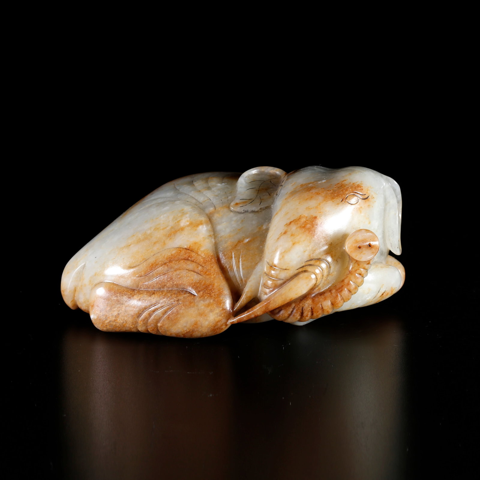 A PEACE ELEPHANT-SHAPED HETIAN JADE ORNAMENT: Peace Elephant-shaped Hetian Jade Ornament