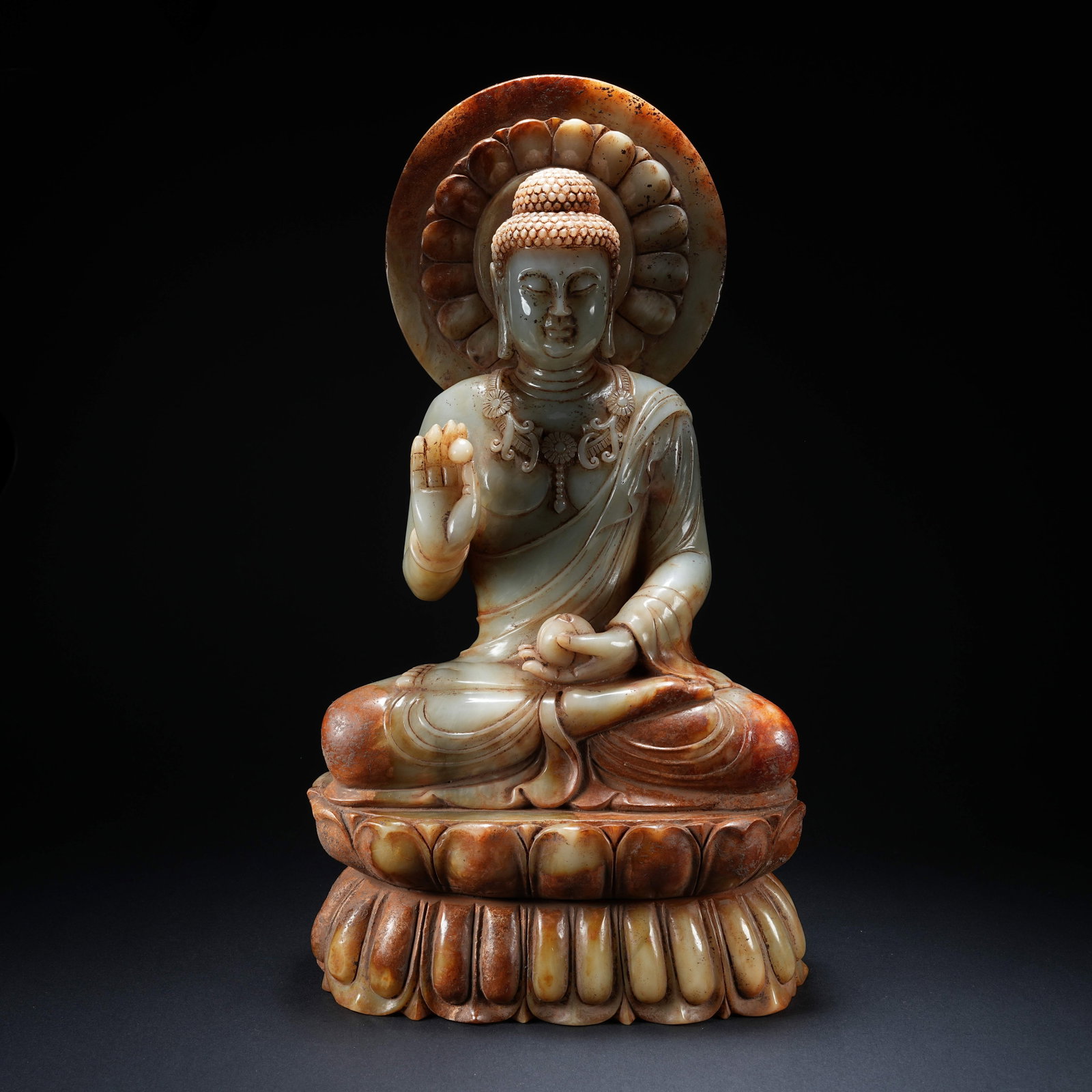 A HETIAN JADE SEATED BUDDHA STATUE WITH HALO (1 of 9)