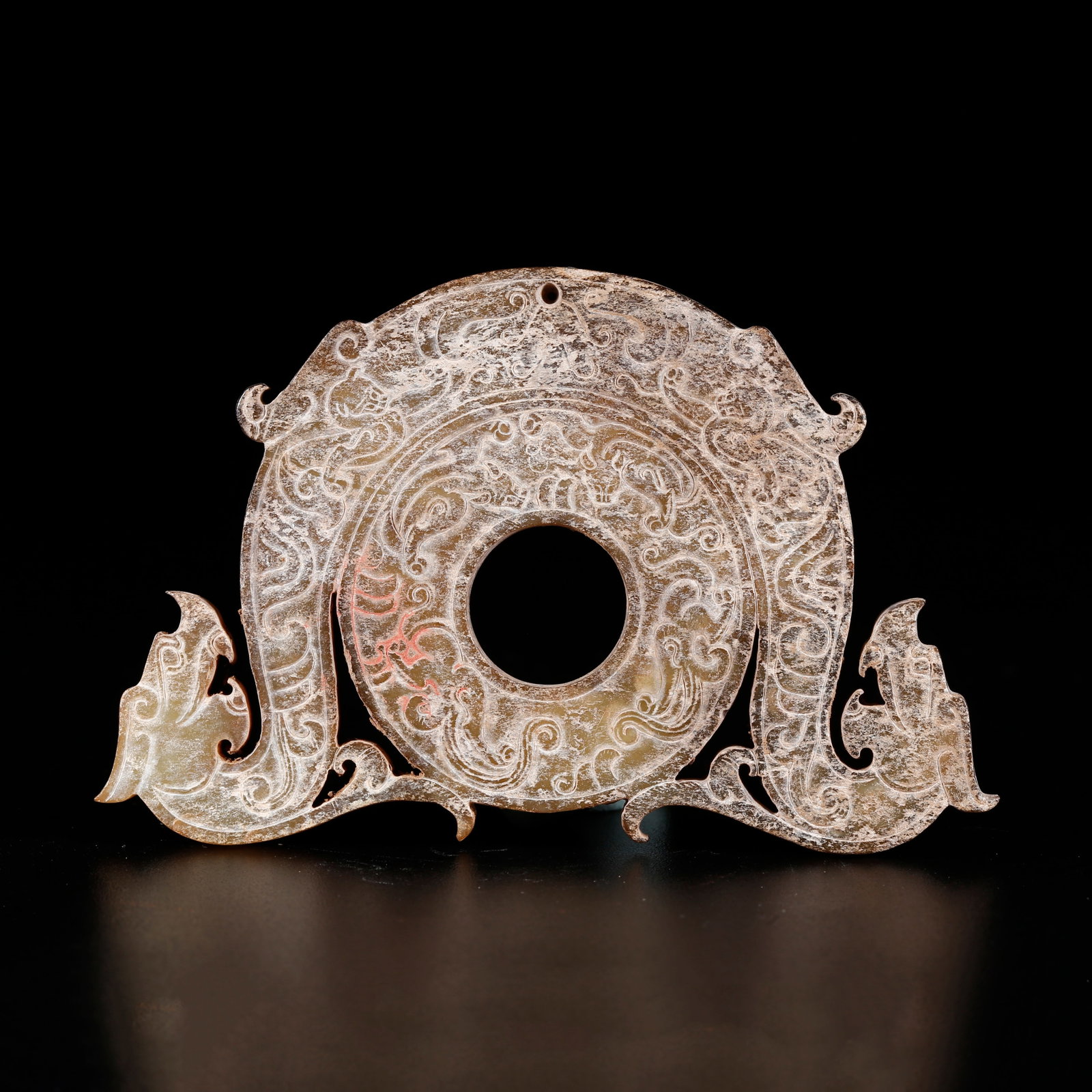 A ARCHAIC JADE BI DISC CARVED WITH DRAGON PATTERNS (1 of 9)
