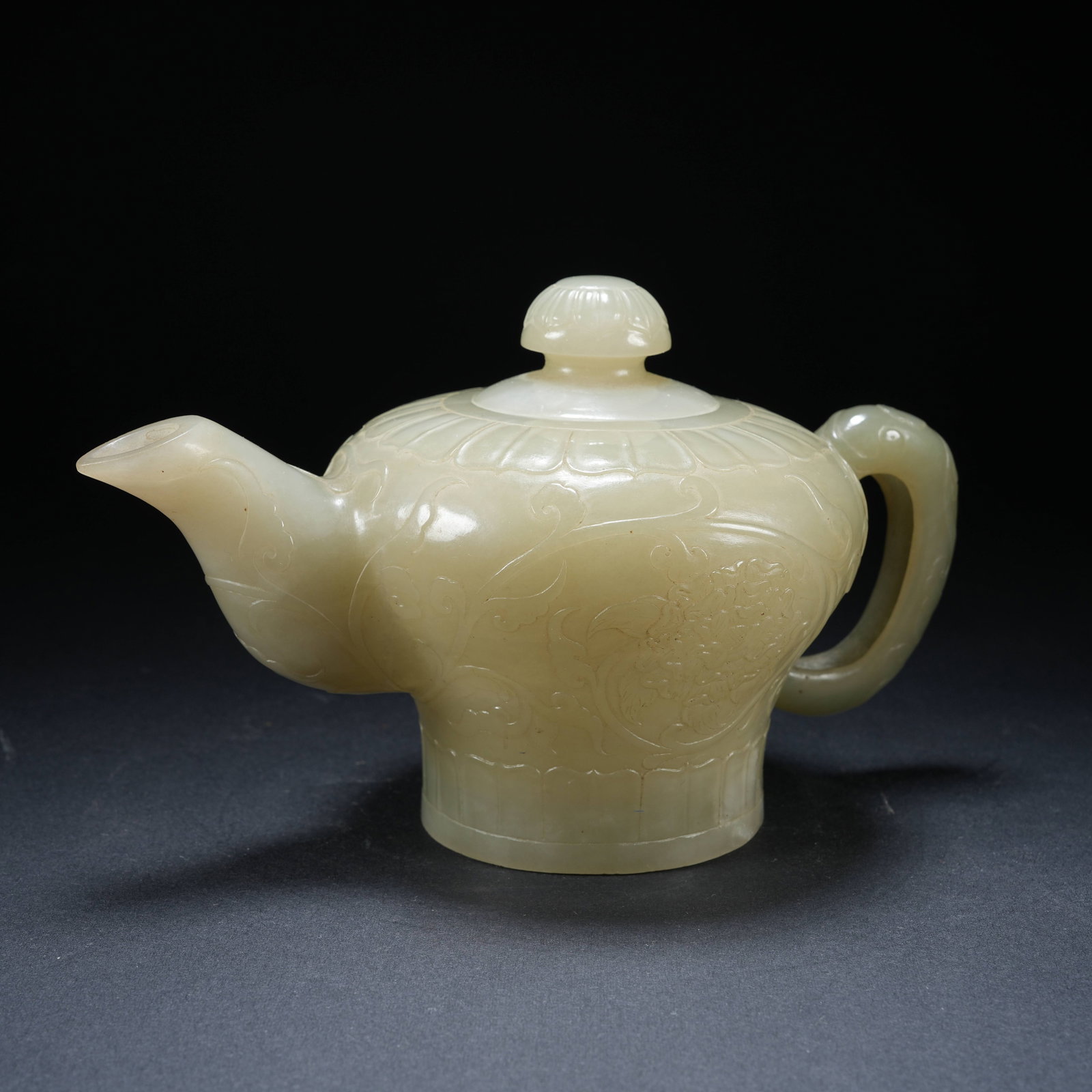 A HETIAN JADE EWER WITH FLORAL PATTERN: Hetian Jade Ewer with Floral Pattern