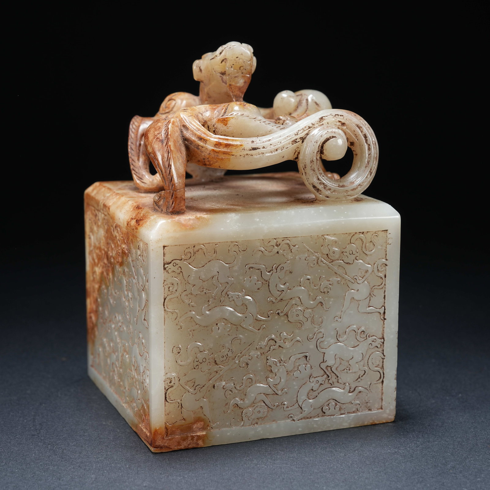 A HETIAN JADE DRAGON KNOB SEAL WITH HUNTING PATTERN (1 of 8)
