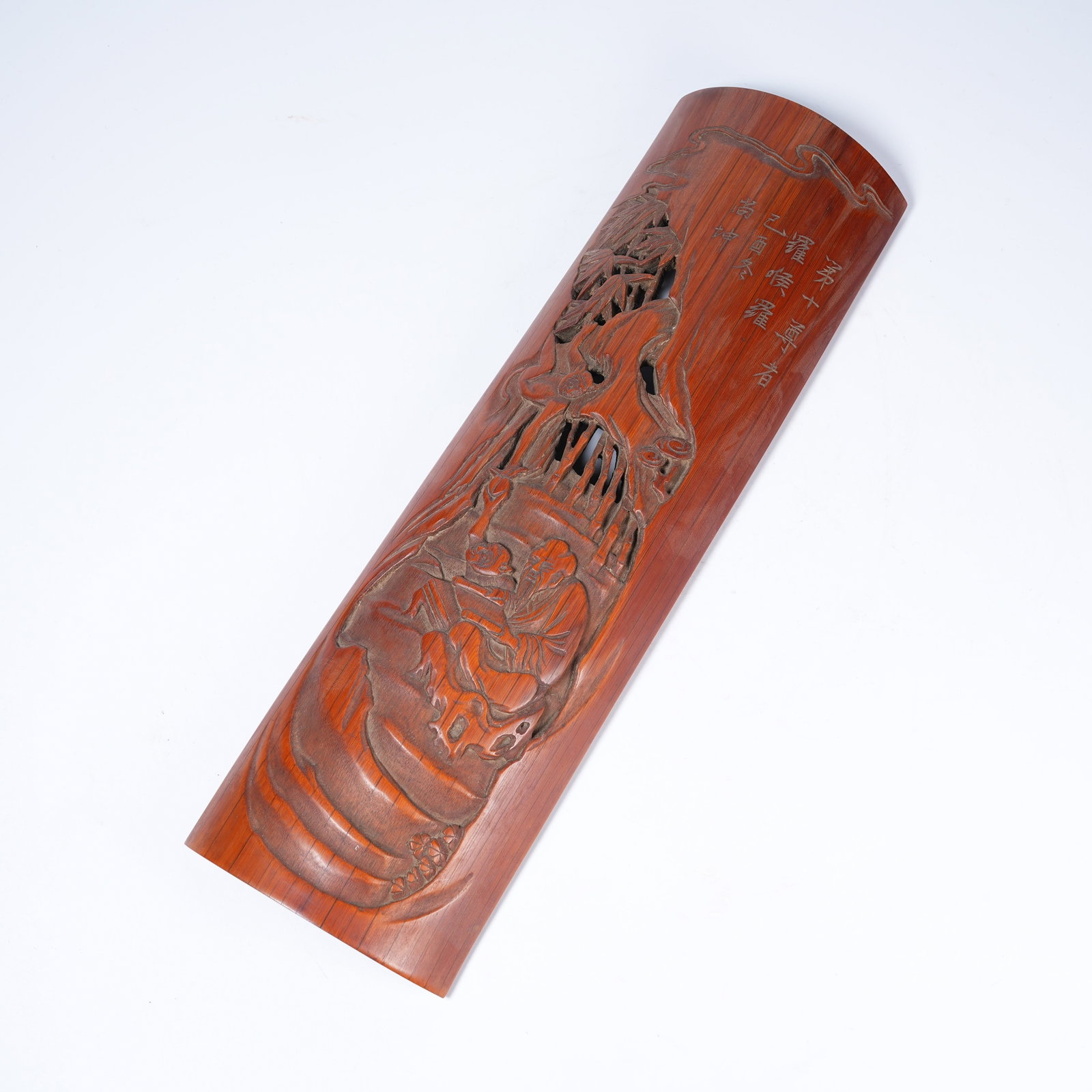 A BAMBOO ROOT CARVED WRIST REST WITH ARHAT PATTERN (1 of 10)