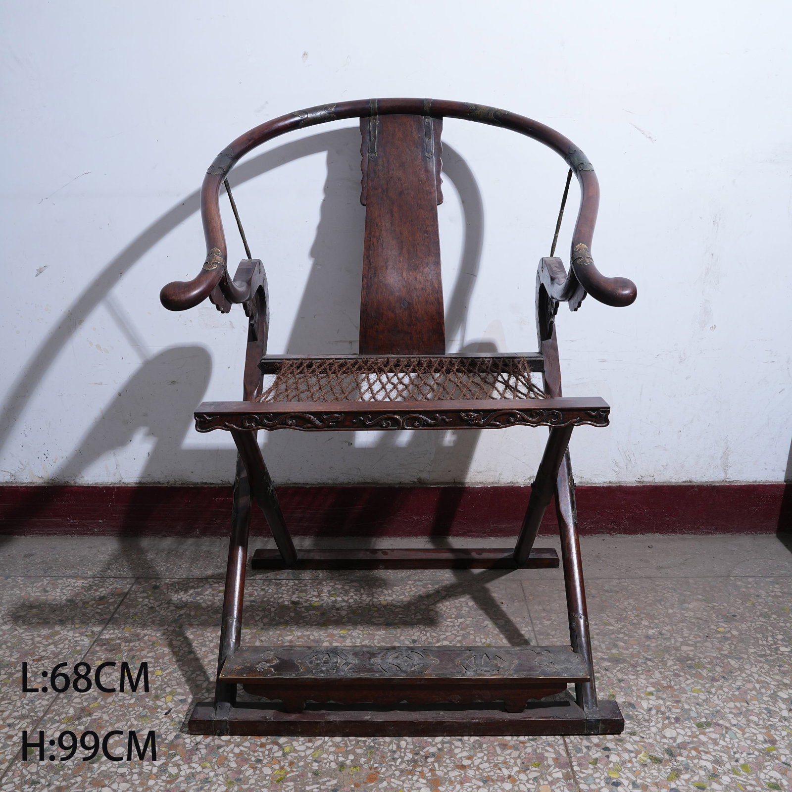 A HUANGHUALI WOOD FOLDING CHAIR: Huanghuali Wood Folding Chair