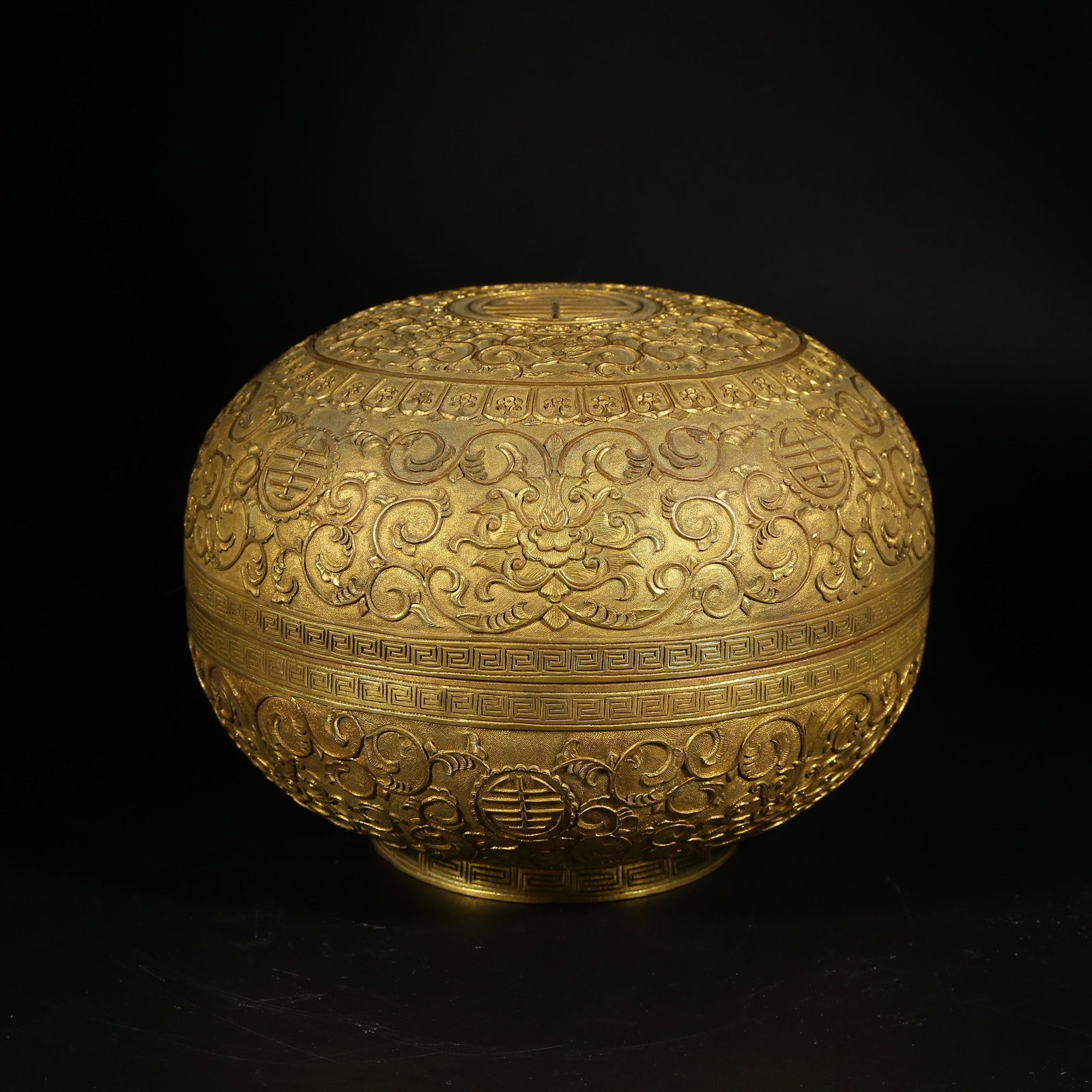 A GILT BRONZE COVERED BOX WITH INTERLACED FLORAL DESIGN: Gilt Bronze Covered Box with Interlaced Floral Design