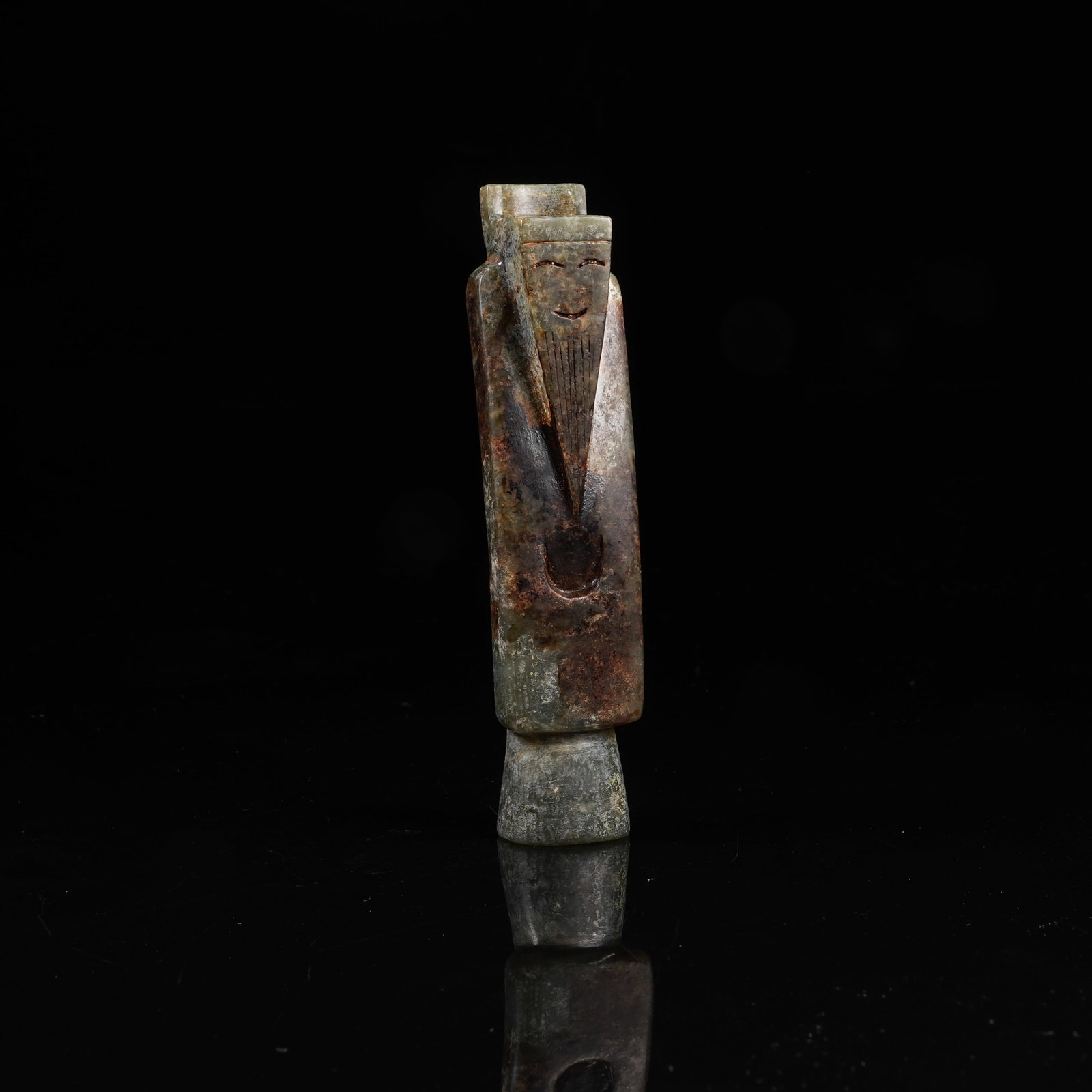 A ARCHAIC JADE WENGZHONG FIGURINE: Archaic Jade Wengzhong Figurine