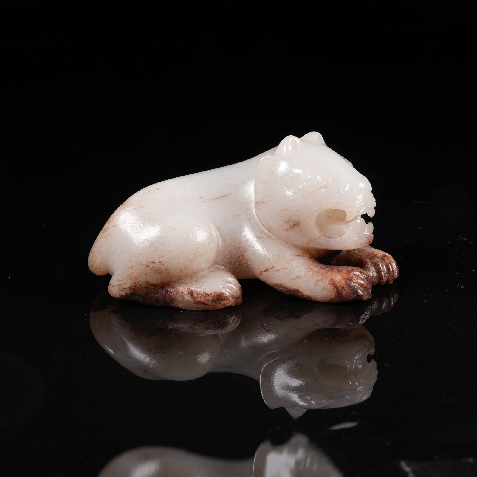 A ARCHAIC JADE RECUMBENT TIGER ORNAMENT: Archaic Jade Recumbent Tiger Ornament
