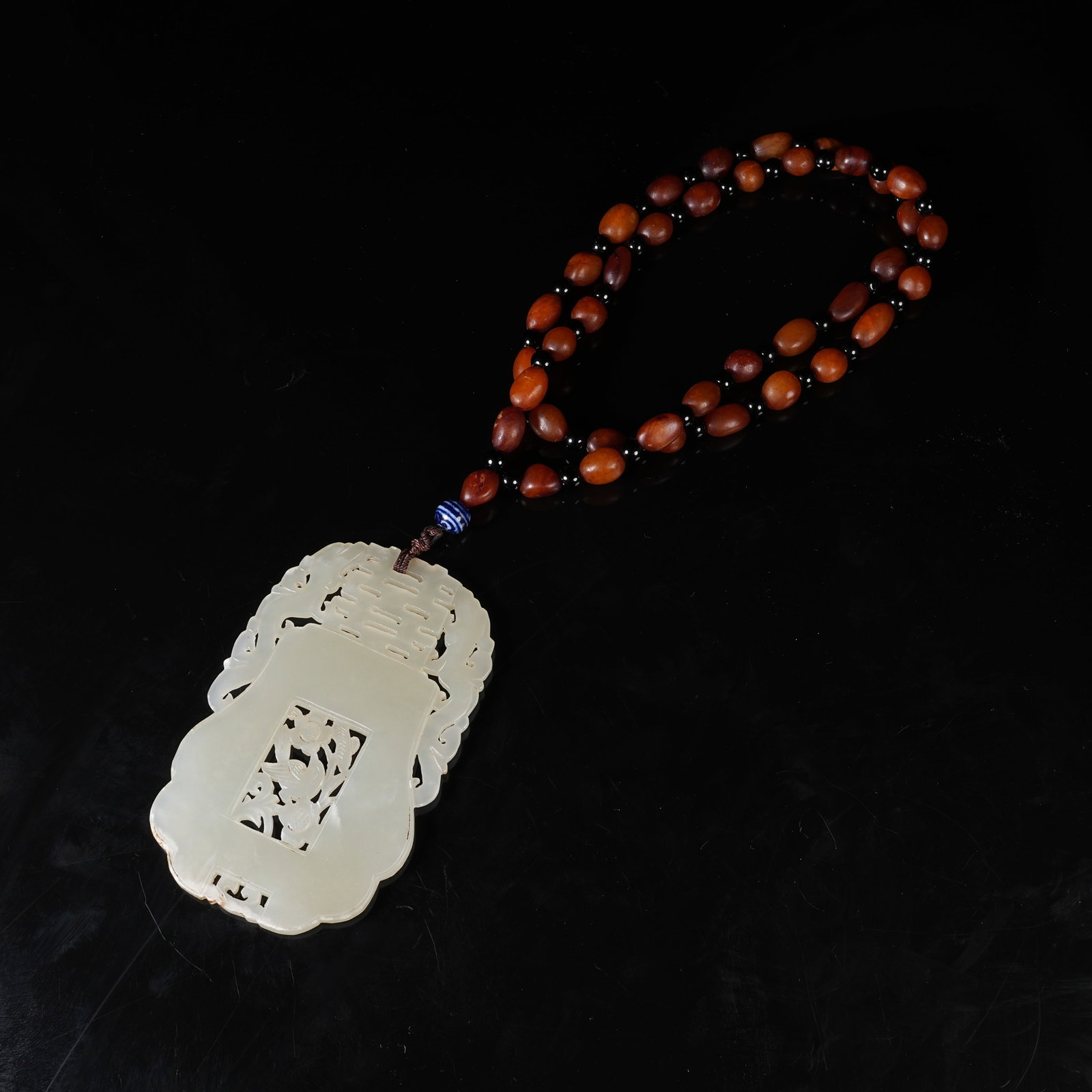 A NEPHRITE PLAQUE WITH FLOWER-BIRD AND HAPPINESS CHARACTER PATTERN: Nephrite Plaque with Flower-Bird and Happiness Character Pattern