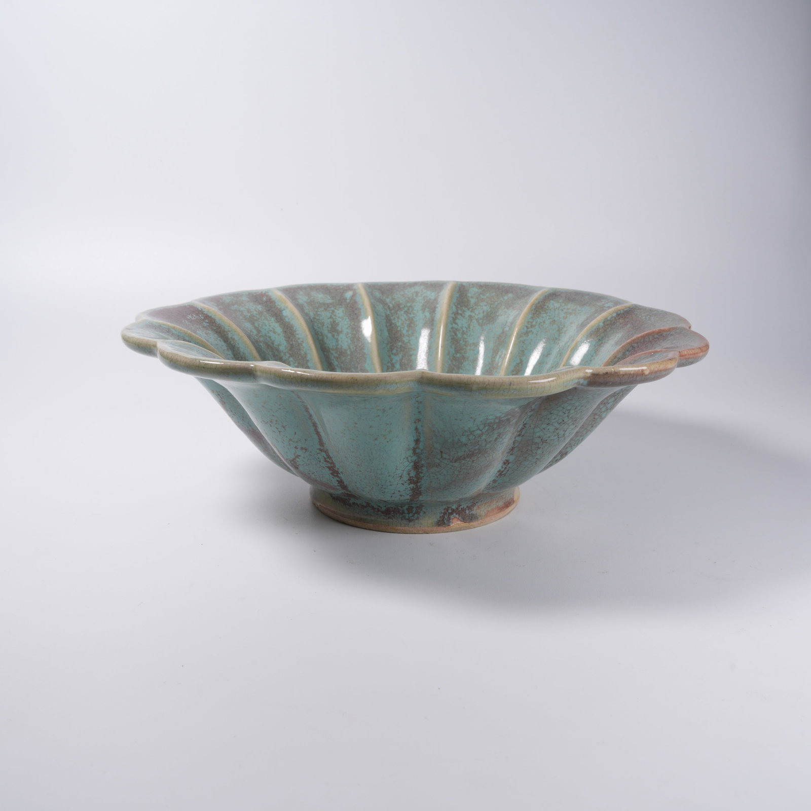 A FLAMBE GLAZED FLOWER-SHAPED WASHER: Flambe Glazed Flower-shaped Washer