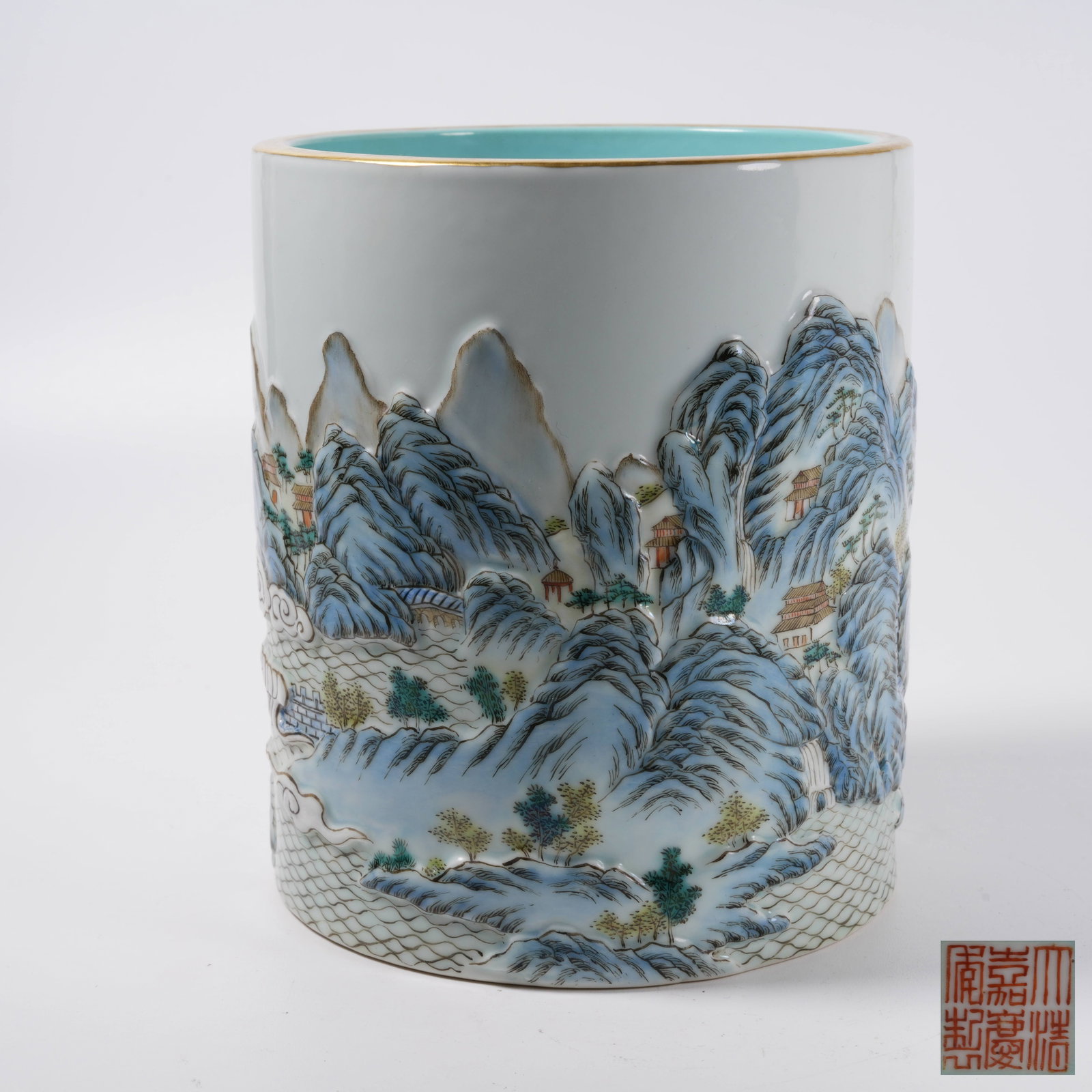 A FAMILLE ROSE CARVED PORCELAIN BRUSH POT WITH LANDSCAPE AND PAVILION PATTERN (1 of 9)