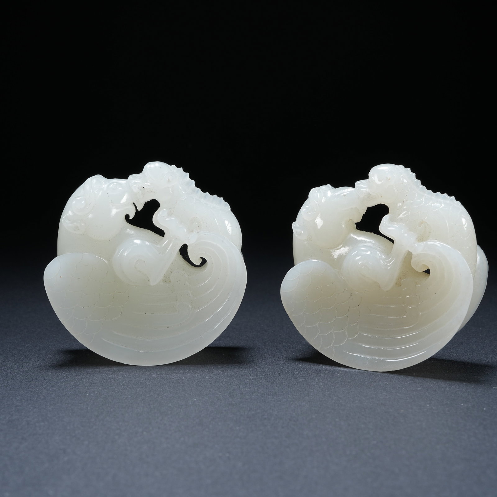 A SET OF HETIAN JADE HERO-THEMED HAND PIECES (1 of 8)