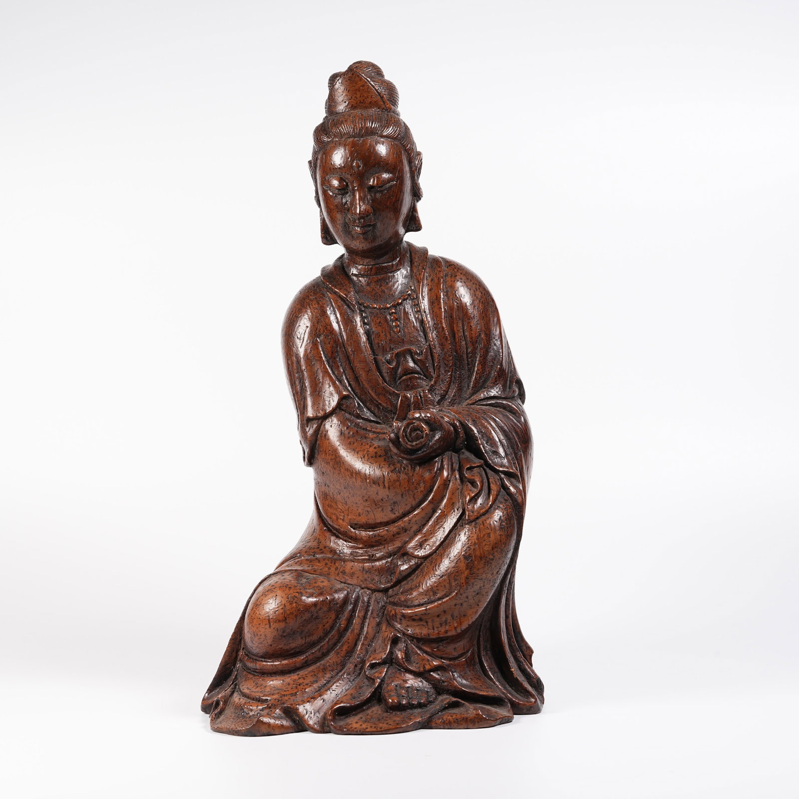 A BAMBOO ROOT CARVED SCROLL-HOLDING GUANYIN STATUE (1 of 9)