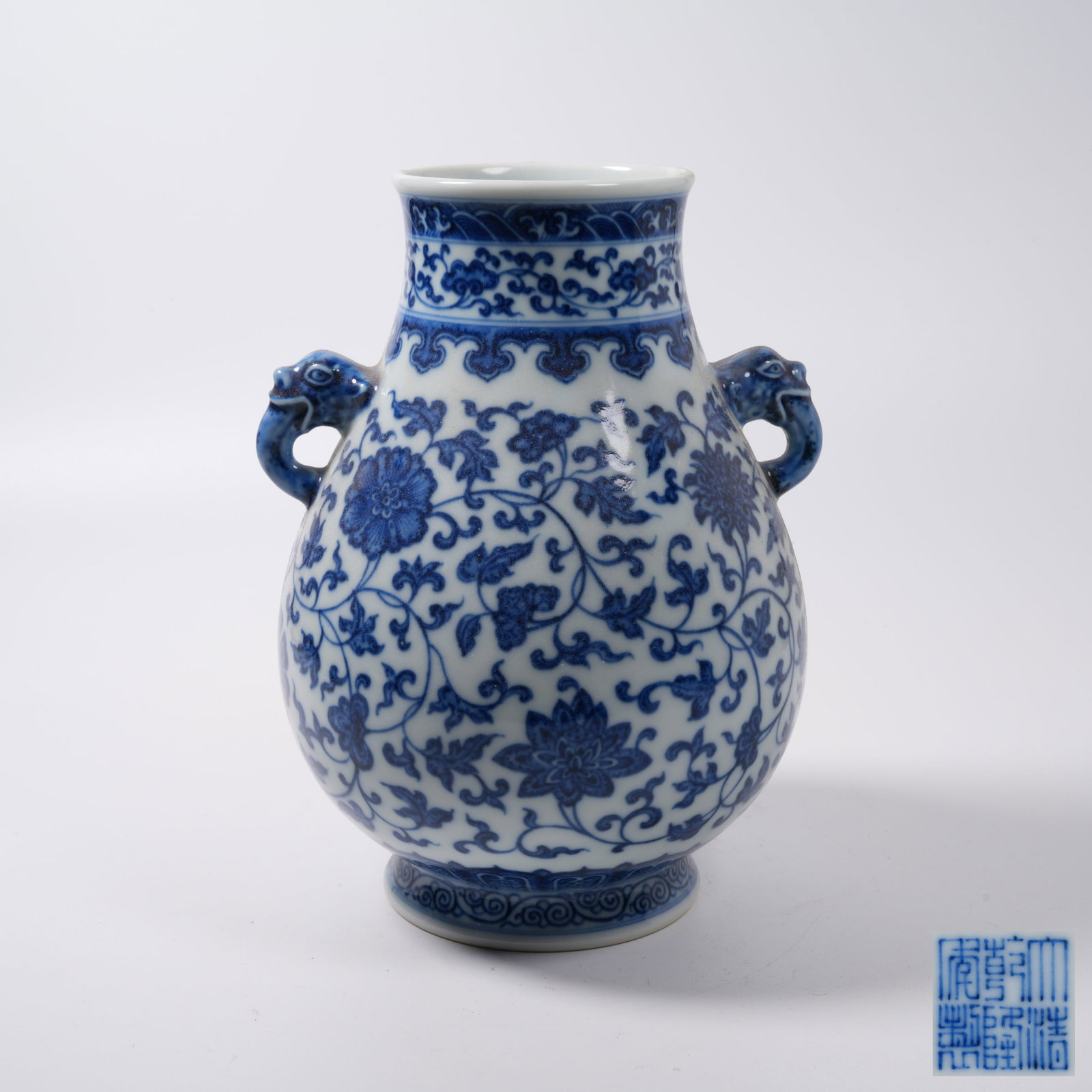 A BLUE AND WHITE ANIMAL-EARED ZUN WITH INTERLOCKING FLORAL PATTERN (1 of 9)