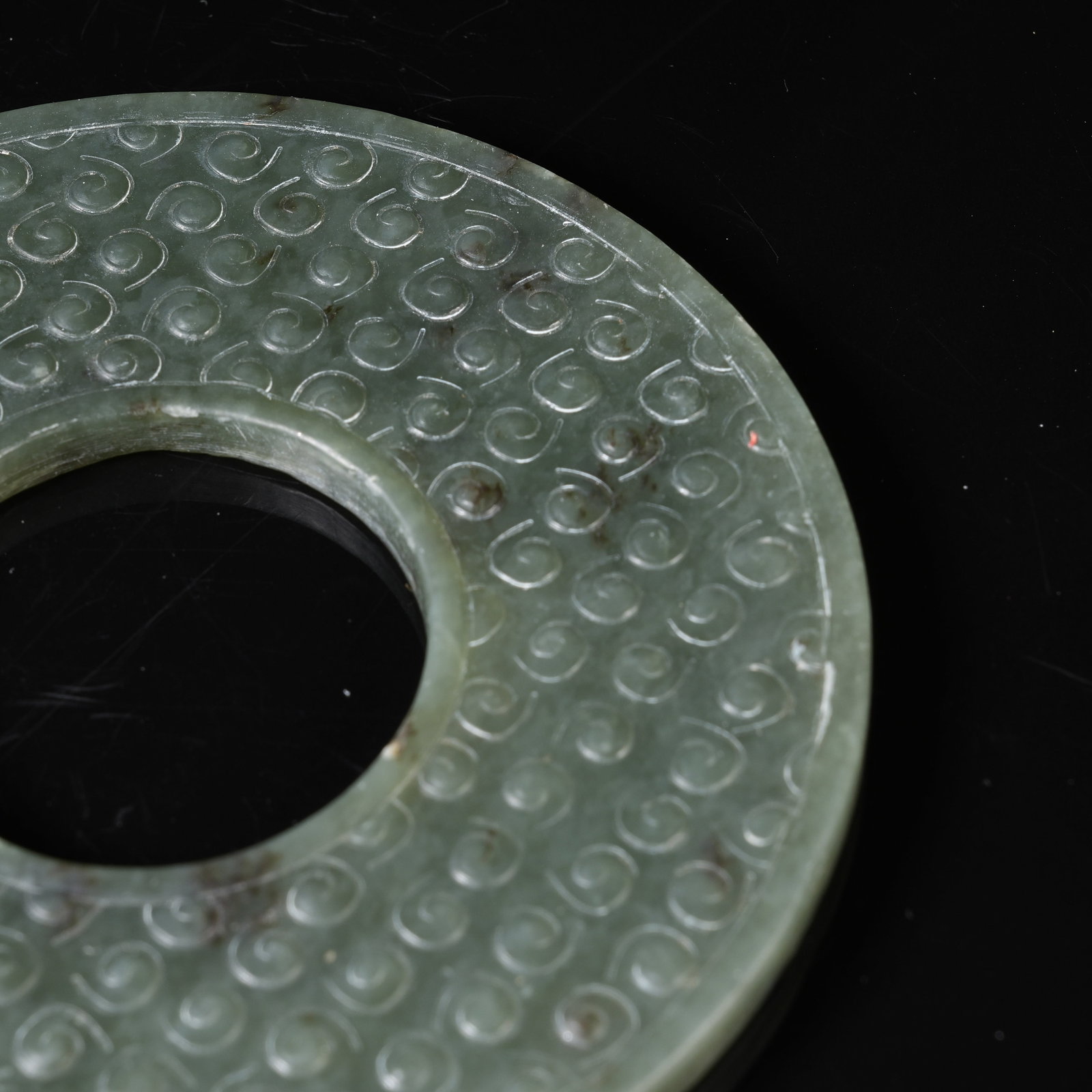 A GREEN NEPHRITE BI DISC WITH INTERLOCKING CLOUD PATTERN - 9