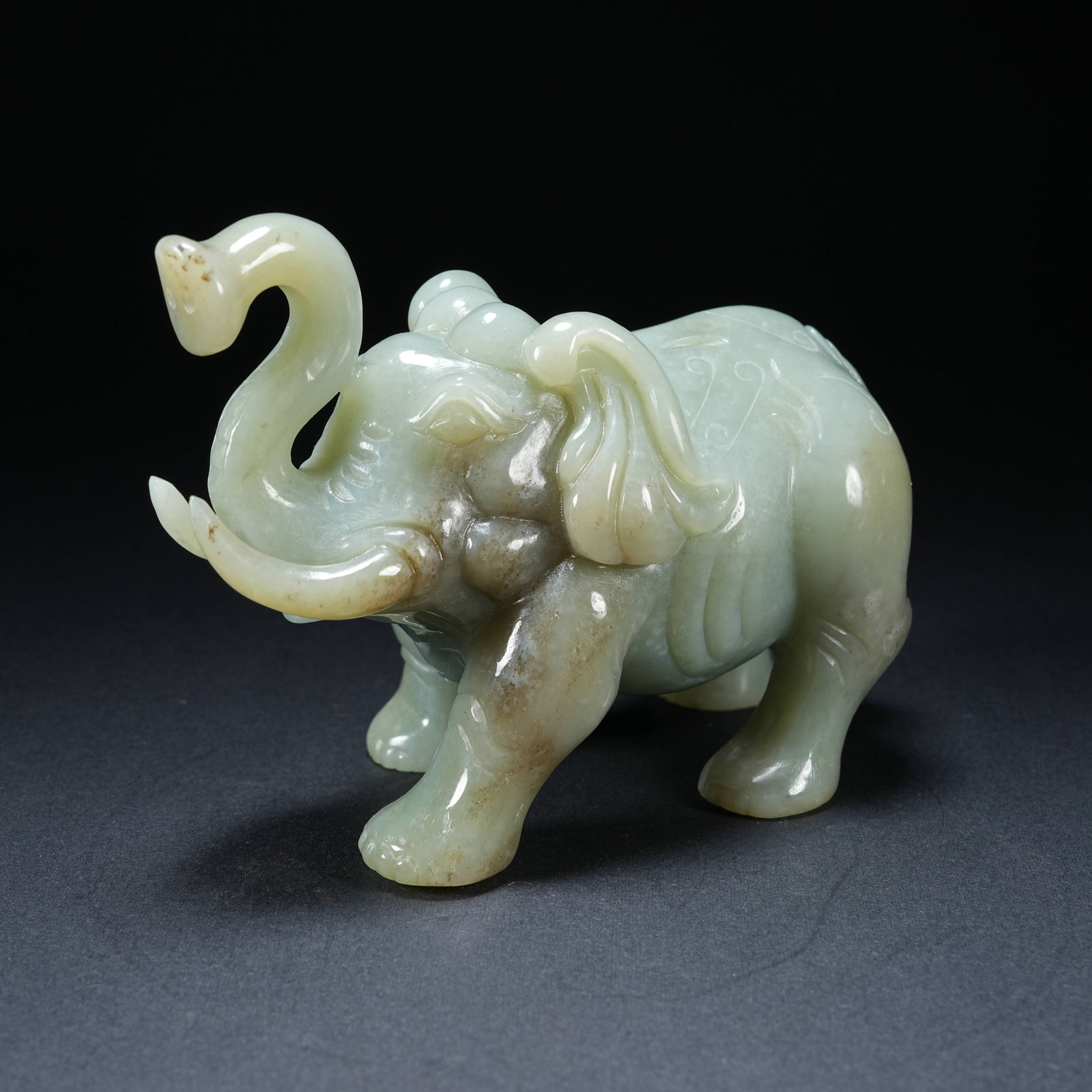 A HETIAN JADE PEACE ELEPHANT ORNAMENT: Hetian Jade Peace Elephant Ornament