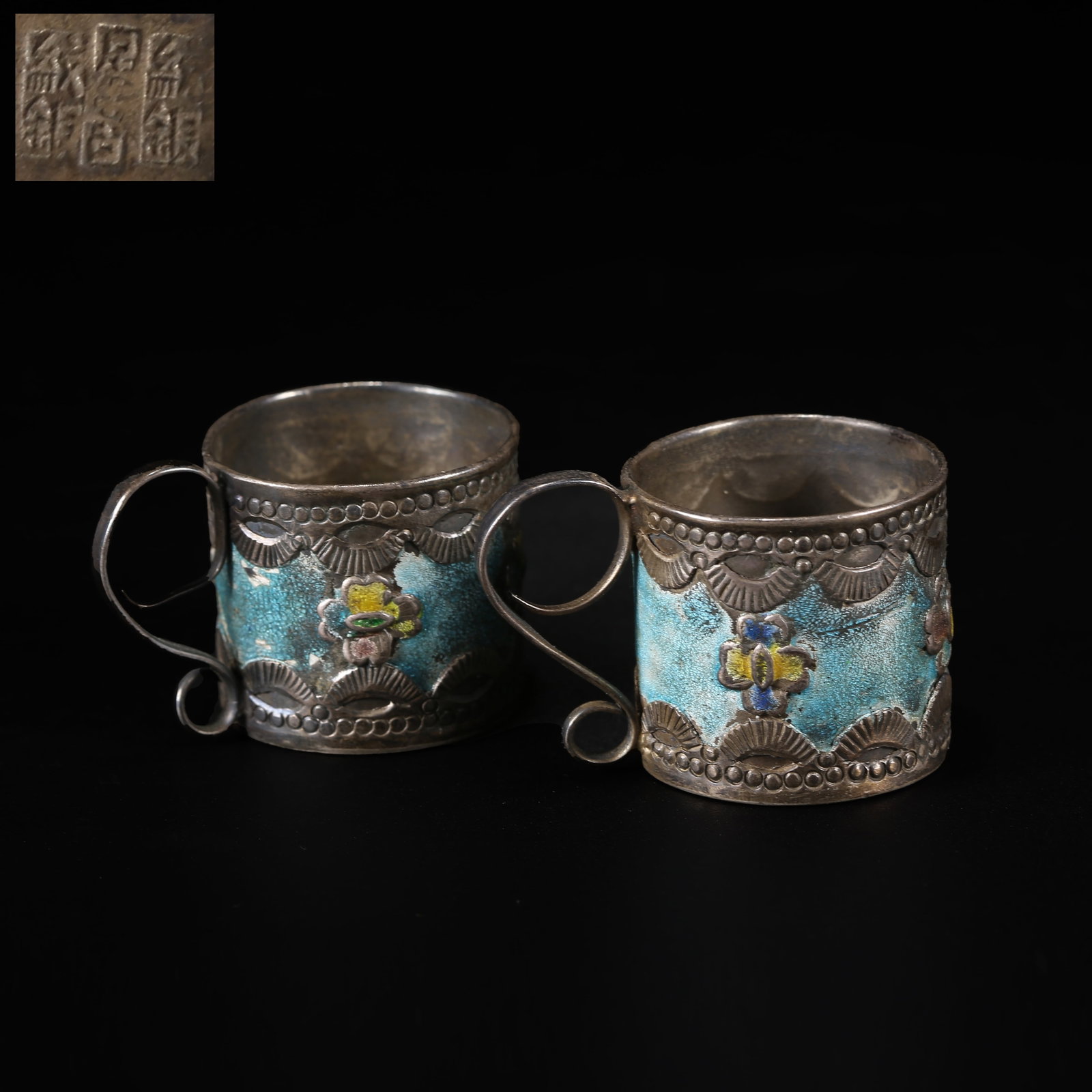A SET OF SILVER FIRE-BLUE CUPS WITH HANDLES: Set of Silver Fire-Blue Cups with Handles