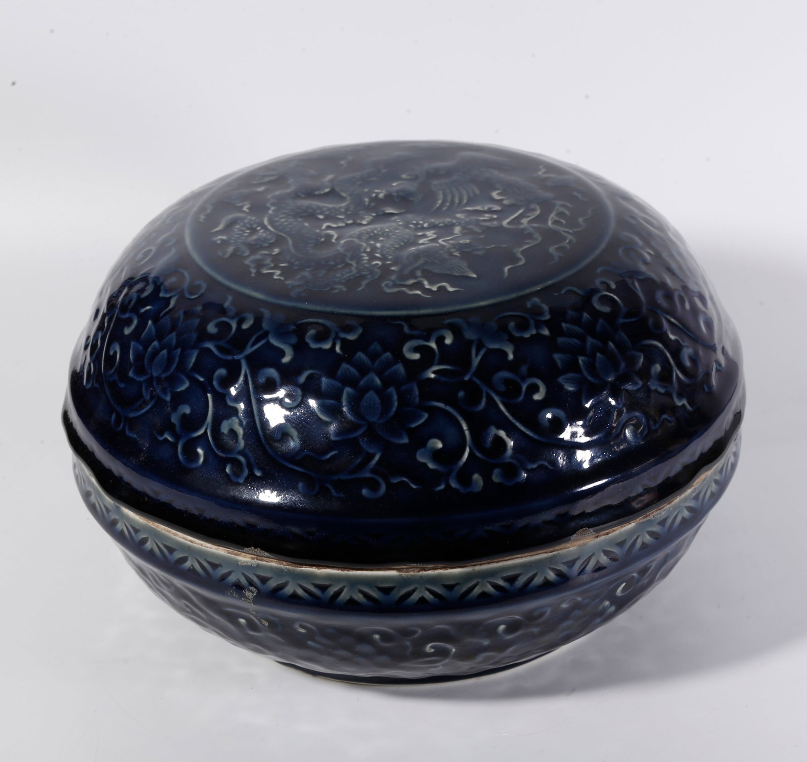 A BLUE GLAZE HAND-HELD BOX WITH DRAGON AND PHOENIX PATTERNS: Blue Glaze Hand-held Box with Dragon and Phoenix Patterns
