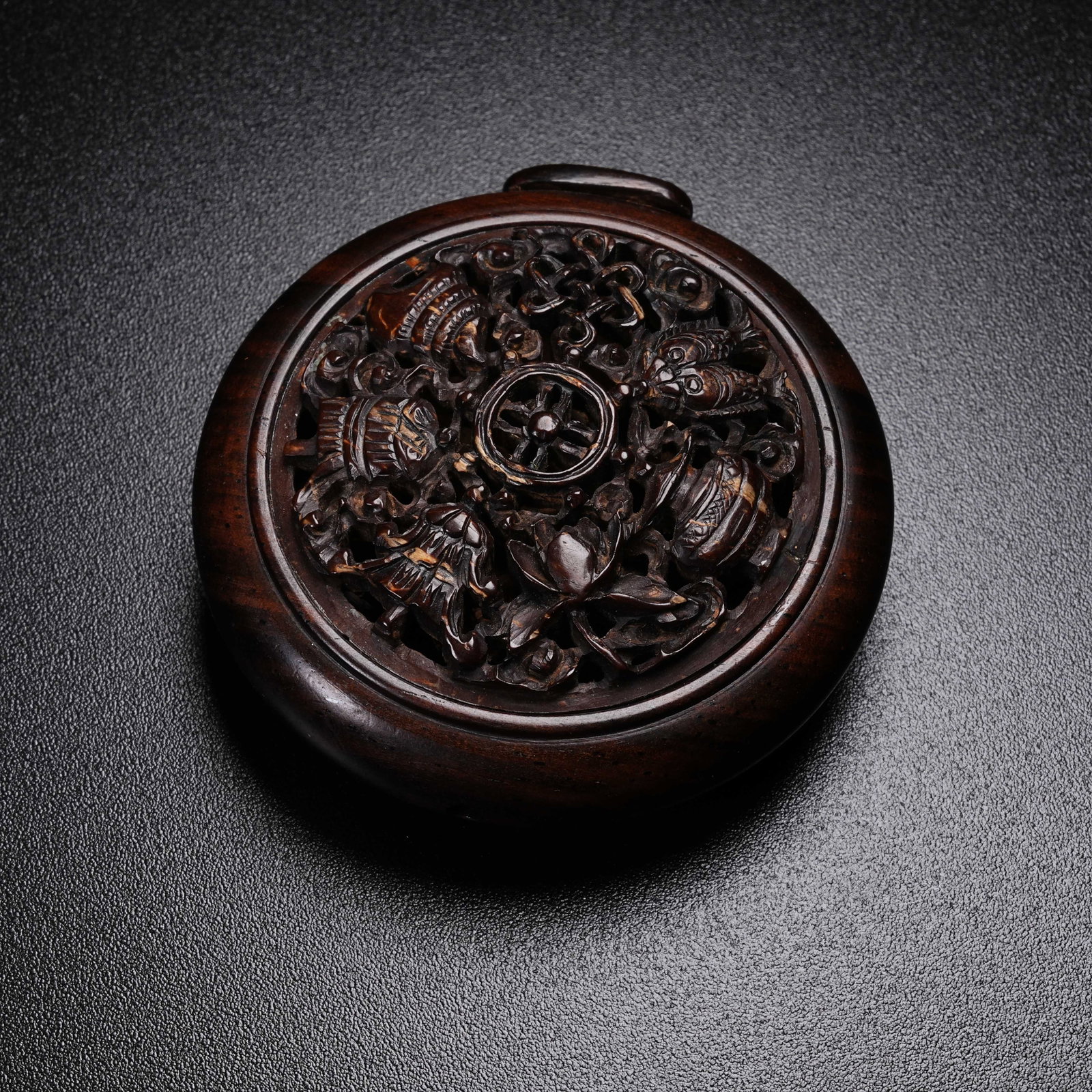 A RED SANDALWOOD SACHET WITH EIGHT TREASURES PATTERN: Red Sandalwood Sachet with Eight Treasures Pattern