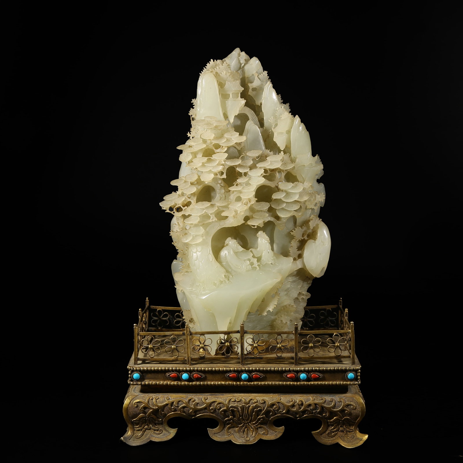 A HETIAN JADE SCHOLAR UNDER PINE TREE MOUNTAIN ORNAMENT WITH GILT BRONZE BASE: Hetian Jade Scholar under Pine Tree Mountain Ornament with Gilt Bronze Base