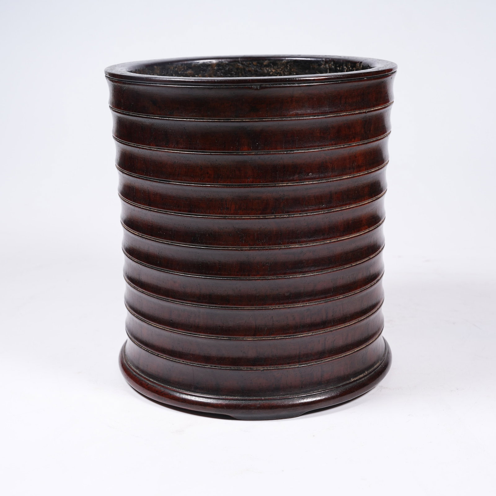 A HUANGHUALI WOOD STRING-PATTERN BRUSH POT: Huanghuali Wood String-pattern Brush Pot