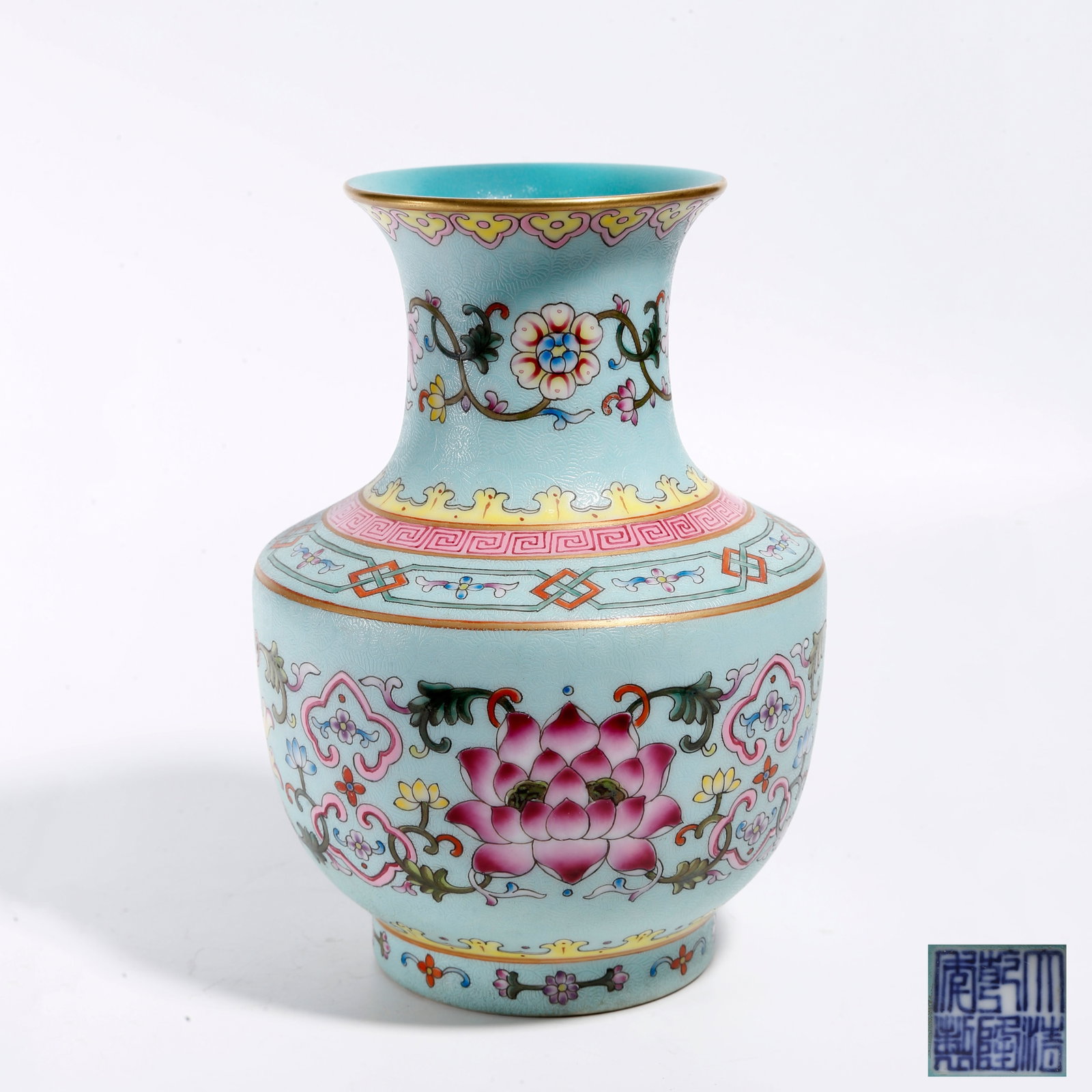 A TURQUOISE-GROUND CARVED INTERLOCKING FLORAL ORNAMENT: Turquoise-ground Carved Interlocking Floral Ornament